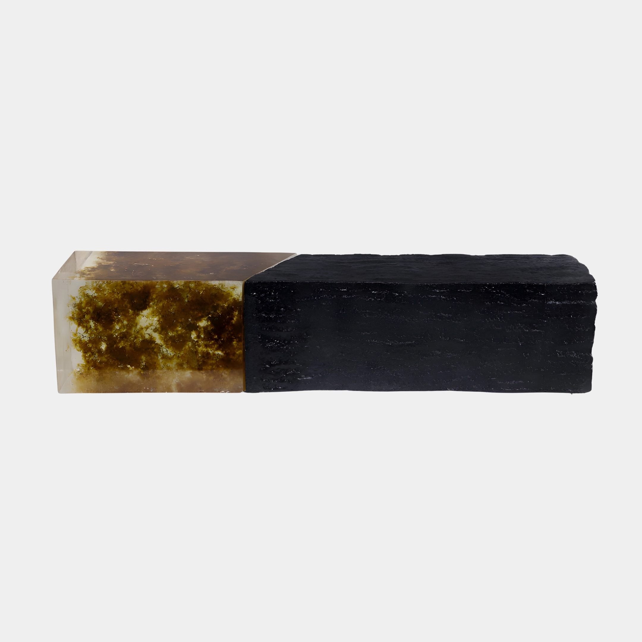 Mossy Inlay Resin & Black Fiberglass Console Block from Giant Sculptures, with a translucent amber-mossy resin end joined to a textured black block, on white.