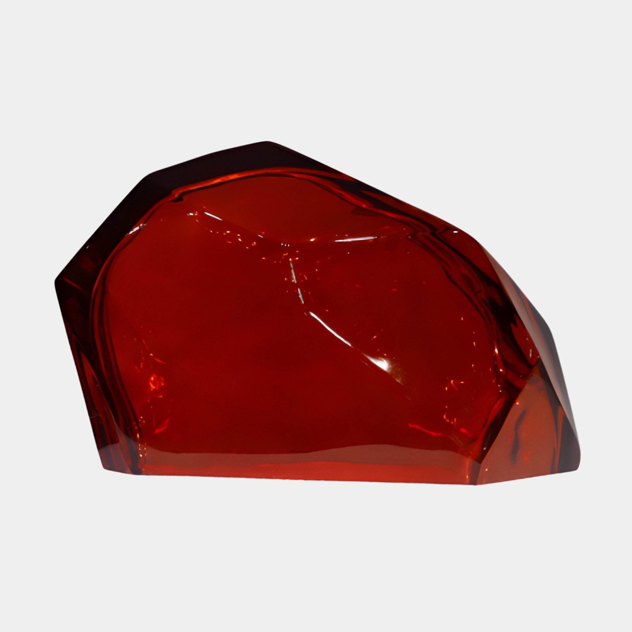 Faceted deep red translucent resin fragment sculpture by Giant Sculptures, shown at an angled view with glowing crimson planes against a plain white background.