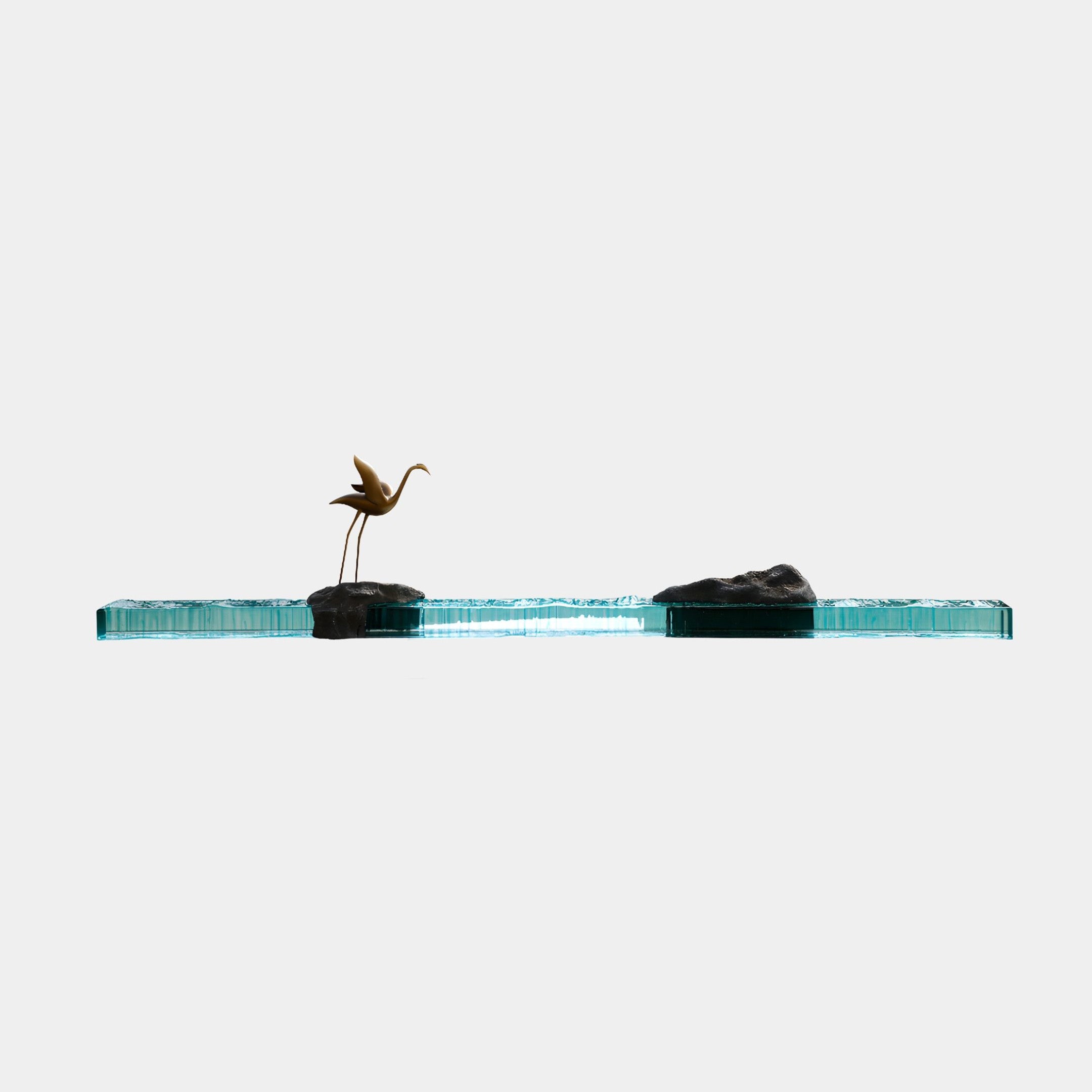 Giant Sculptures Teal Resin & Rocky Island Crane Horizon Sculpture 230cm, slender bronze crane on dark rocks along a long teal glass base, plain white background.
