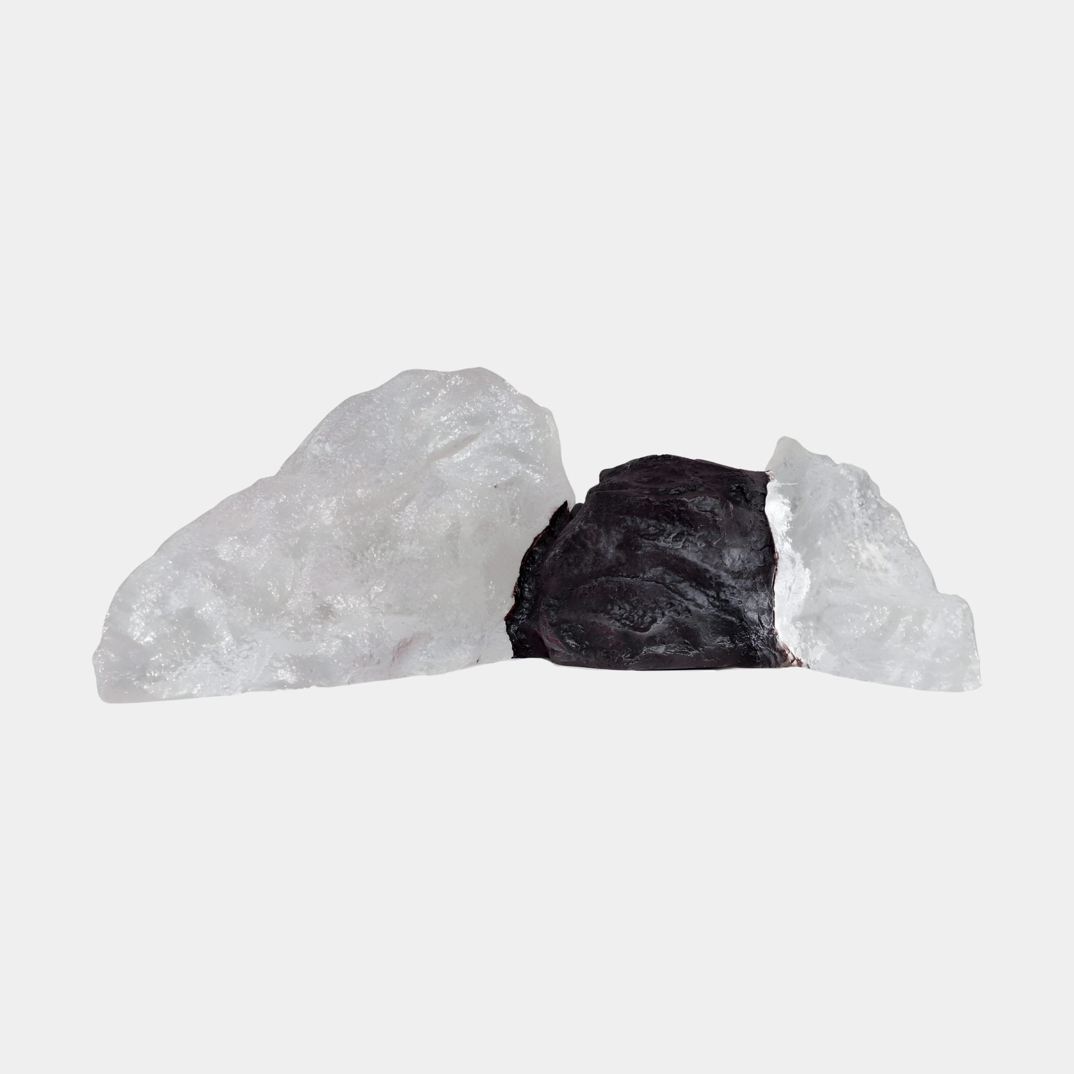 Black Rock Inset White Quartz Resin Landscape Sculpture by Giant Sculptures, a craggy dark stone meeting glassy white quartz-like resin, on a plain background.