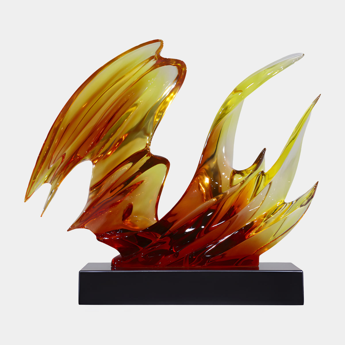 Amber & Red Swept Blade Wave Resin Sculpture, 58cm, with blades shading from yellow-amber to deep red on a black base, set against a plain light background.
