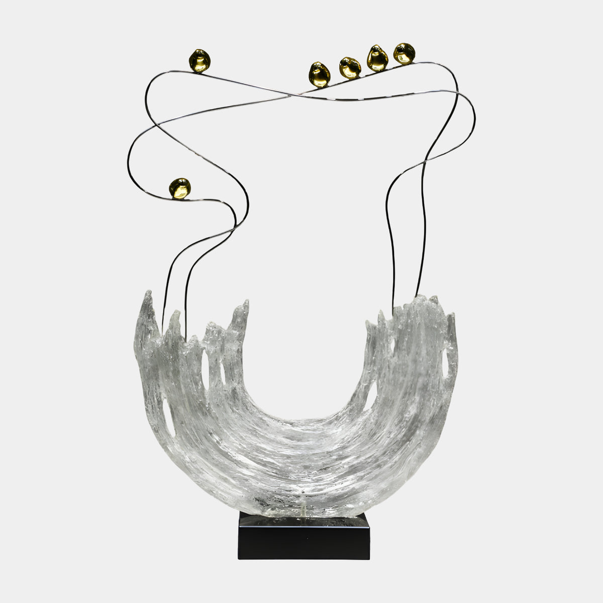 Clear Wave Arc & Gilt Spheres Resin Sculpture - 92cm, a frosted U-shaped resin wave with ridged texture, topped by silver wires looping six gold spheres, on a black base against a plain grey background.