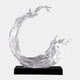 Clear Open Crescent Wave Cast Resin Sculpture, 77cm, curling into a crescent with forked crest on a black marble base, set against a plain light background.