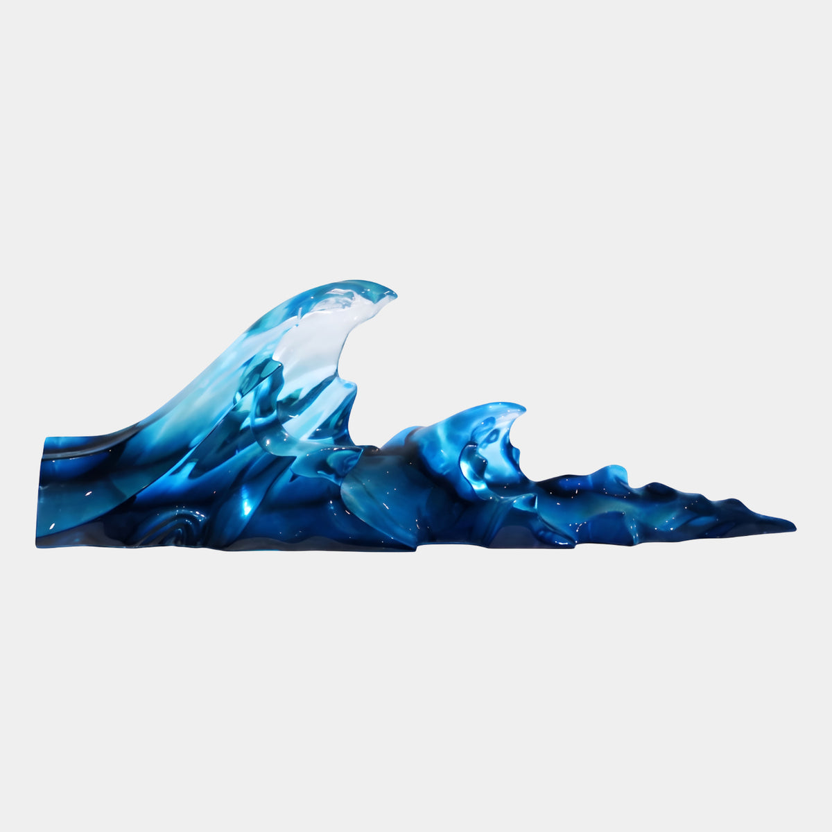 Cobalt Blue Breaking Wave Resin Sculpture - 90cm, a long wave with a tall curling crest and tapering peaks in deep cobalt, navy, and icy blue tones, shown on a plain white background.