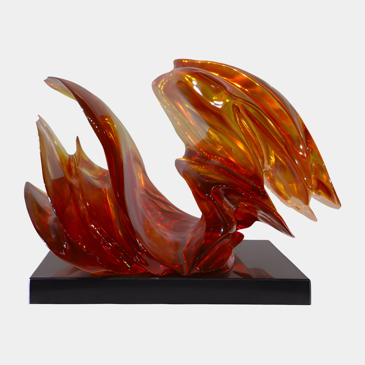 Red & Amber Flame Form Cast Resin Sculpture, 58cm, with flame-like curving points on a black rectangular base, set against a plain white background.