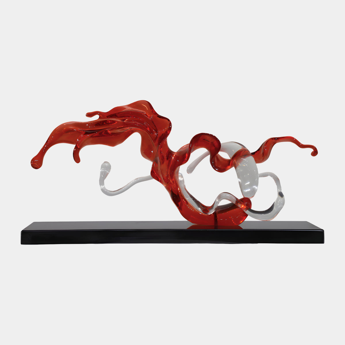 Red & Clear Threaded Ribbon Resin Sculpture, 65cm, with a red ribbon twisting around clear tendrils on a black slab base, set against a plain white background.