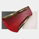 Valmeris Crimson Fold Sculptural Metal 3D Wall Art featuring a sweeping glossy crimson iron arc with polished golden trims over charcoal and ivory back panels, shown on a light background.