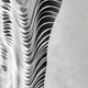 The Ravelle Grey Contour Felt 3D Relief Wall Art by Giant Sculptures features layered, wavy panels on the left for sculptural depth and movement, with a smooth textured white surface on the right.