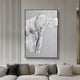 A modern living room showcases the Ravelle Grey Contour Felt 3D Relief Wall Art by Giant Sculptures, featuring wavy black lines on a textured white and gray background above a sofa with beige, gray, and white cushions.