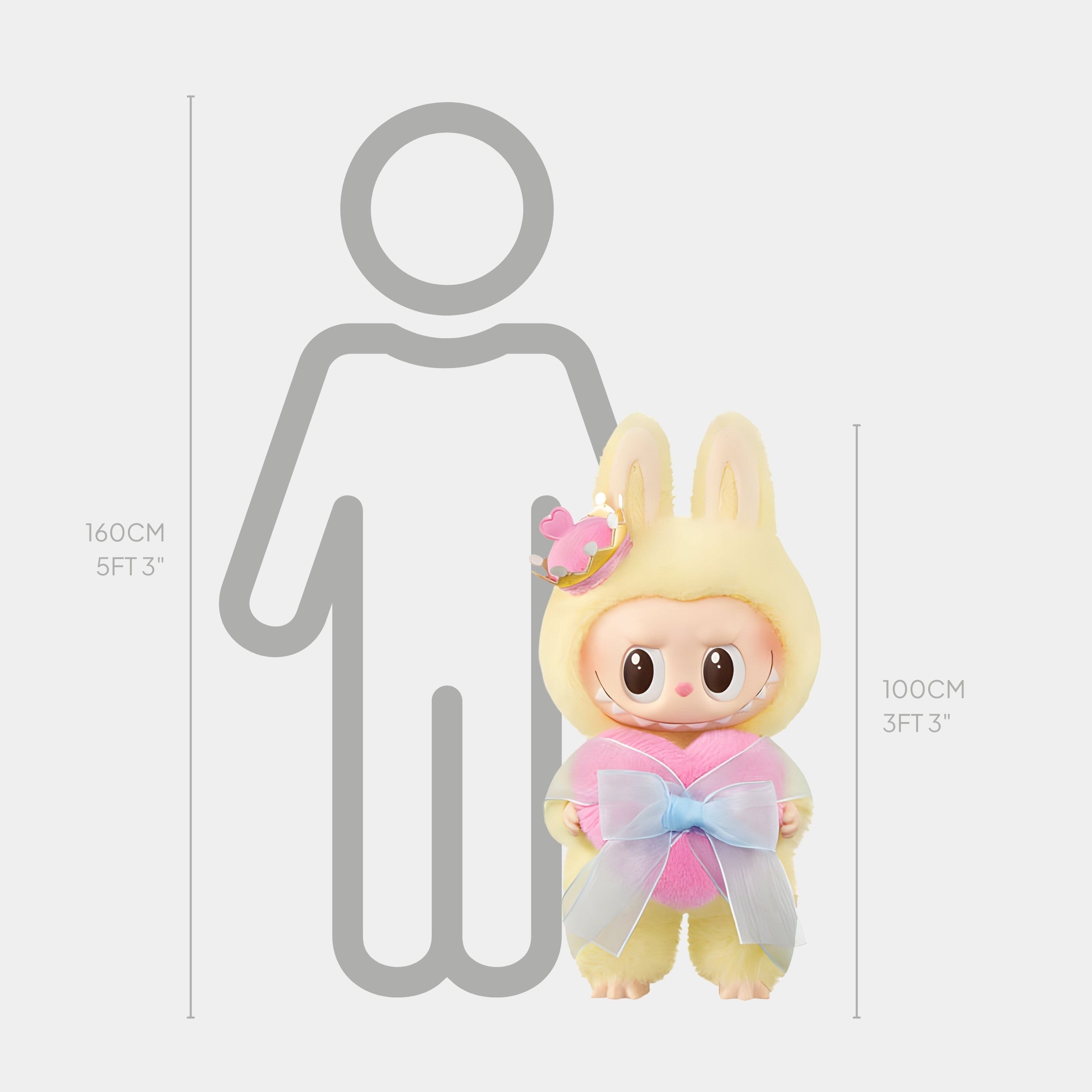 The Giant Sculptures The Monster Lets Checkmate Heart Labubu Sculpture - 100cm is a large doll in a yellow bunny outfit with pastel bow and pink crown, shown beside height markers for 160cm (5ft 3in) and 100cm (3ft 3in), perfect for display.