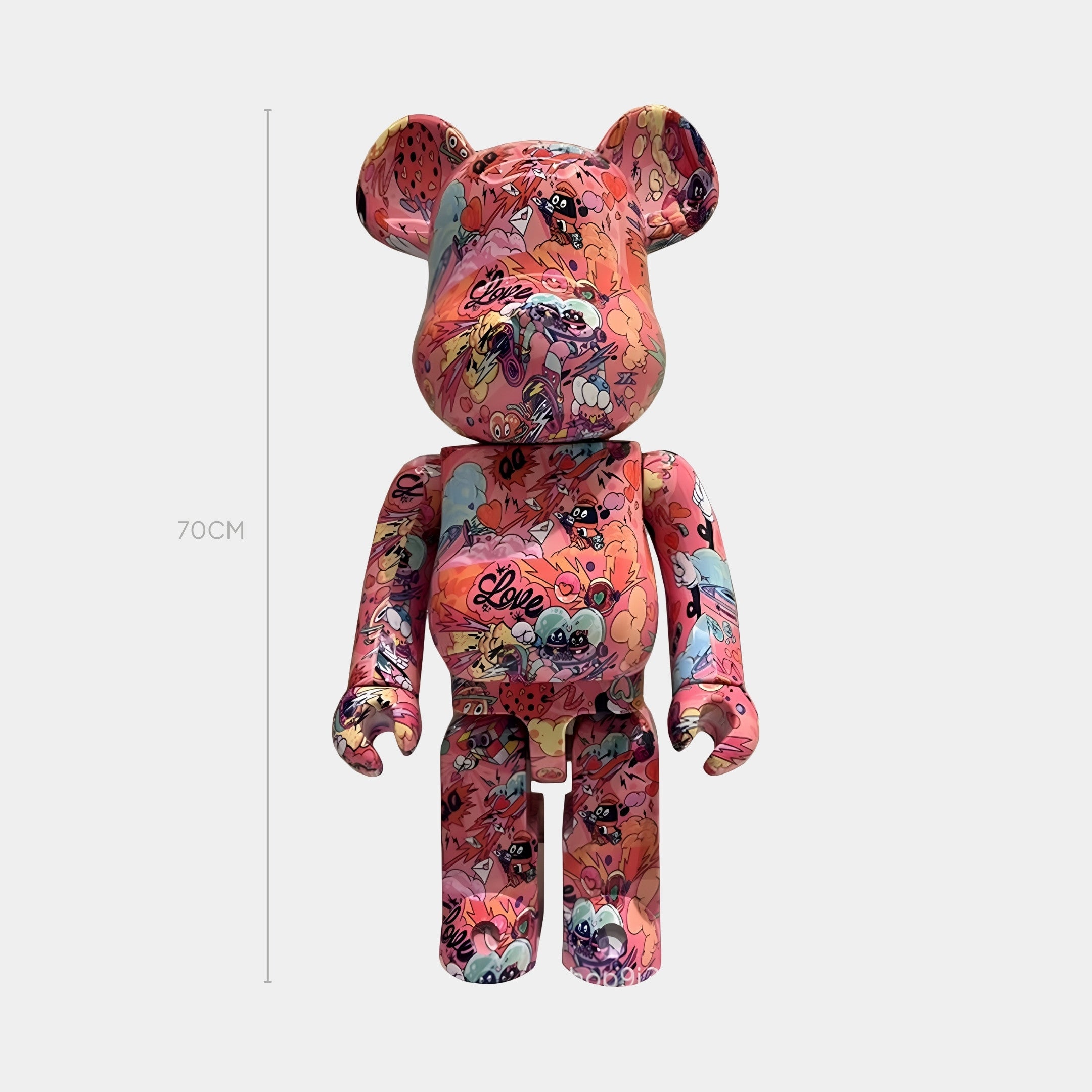 The Giant Sculptures Love Riot Bear Sculpture - 70cm features colorful street-art and cartoon graphics, including the word Love and playful characters, all set against a plain white background.