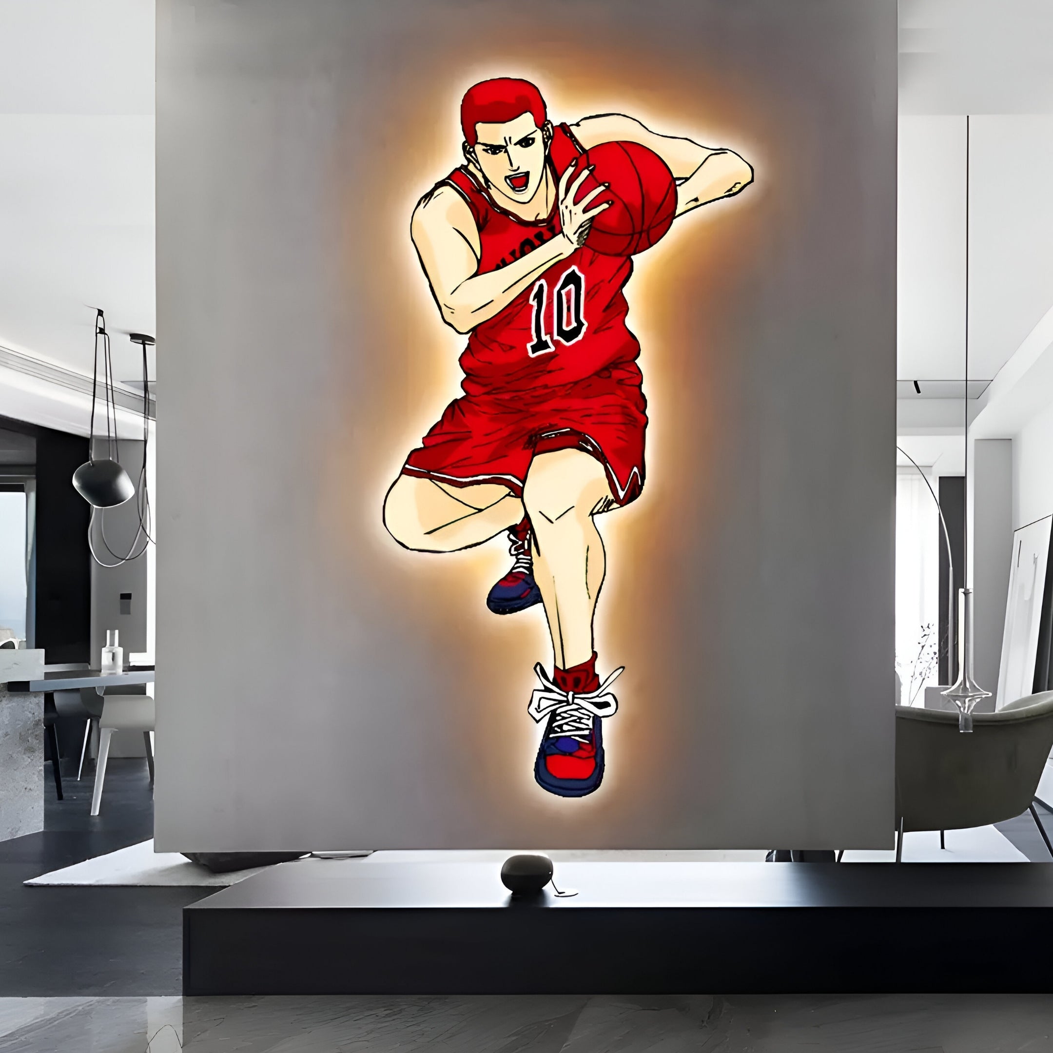 The modern interior features the Enlustra III Game On UV Wood LED Wall Art by Giant Sculptures, depicting an anime basketball player in a red uniform and headband dribbling a ball. Ideal for digital culture fans, the room has sleek furniture and contemporary decor in neutral tones.