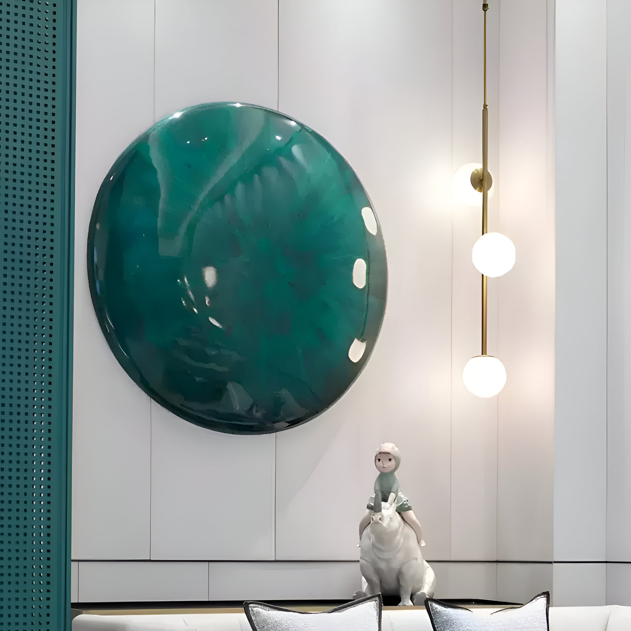 The Genesis Jade 3D Resin Crystal Porcelain LED Wall Art by Giant Sculptures emits a jade-inspired glow near a modern fixture with two spherical bulbs. Below, a small sculpture of a person on a polar bear sits on a shelf, while teal accents enhance the minimalist and serene ambiance.