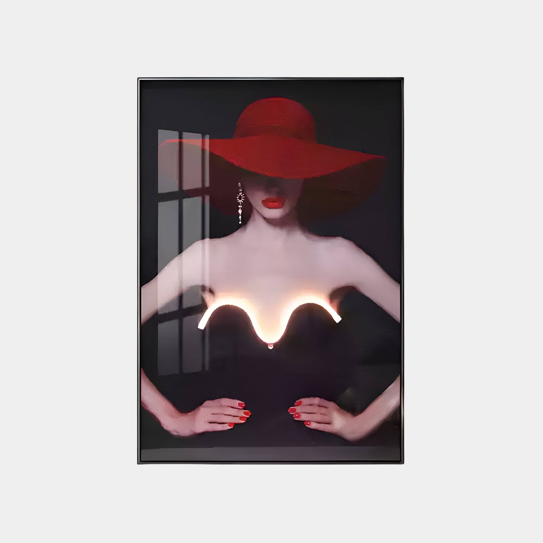 Artistic photo of a person in a strapless black dress and wide-brimmed red hat, with red lips and nails, partly shaded face for mystery. The cutting-edge design is enhanced by Giant Sculptures Elysian Striking Glow 3D LED Wall Art reflecting in the glass frame.