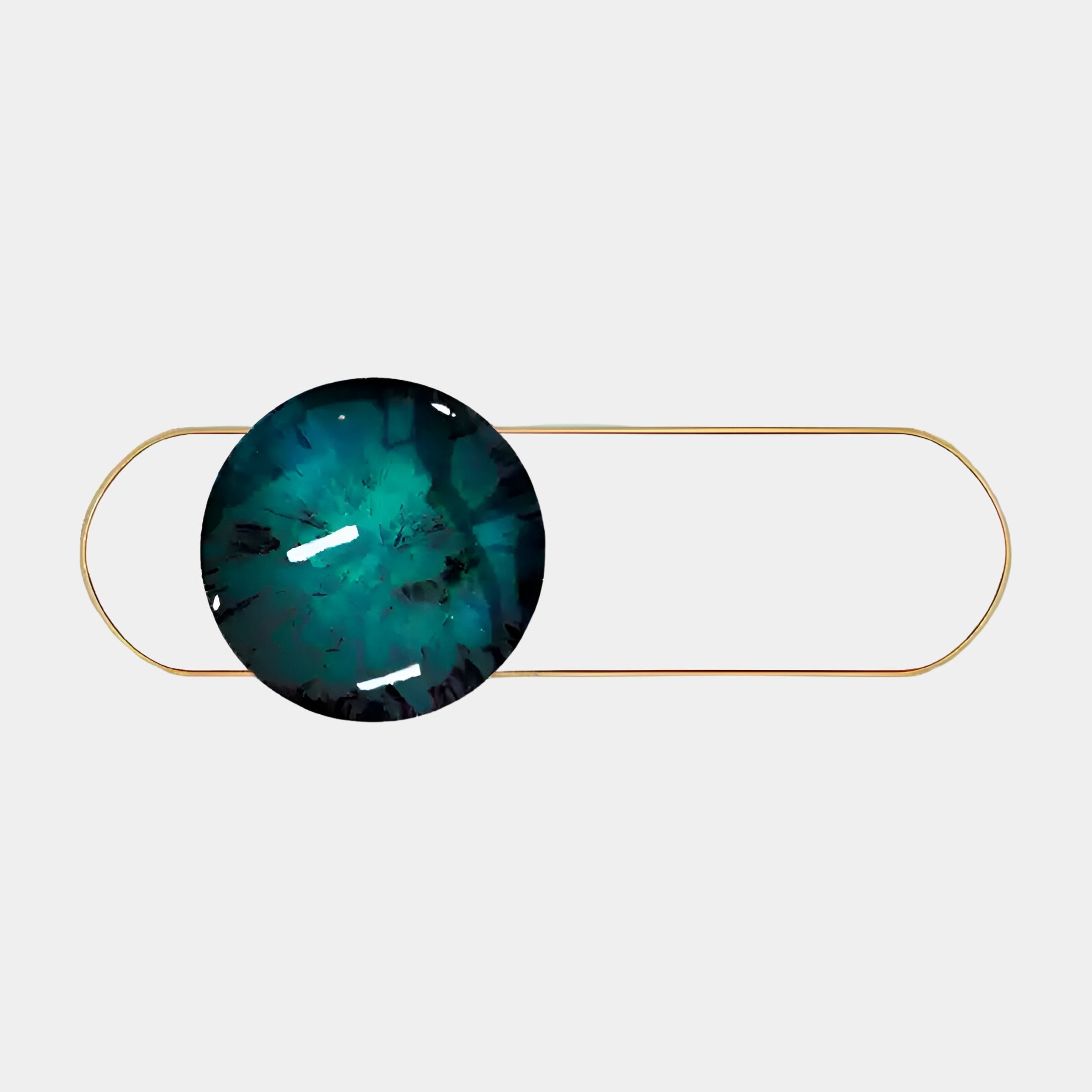 The Vitreon 3D Deep Teal Crystal Porcelain with Gold Accent Wall Art by Giant Sculptures showcases a central round blue gemstone in an oval loop, featuring an abstract luminous pattern that elegantly complements the minimalist gold frame.