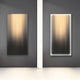 The Celeste Radiance Reflection LED Wall Art by Giant Sculptures features two abstract pieces on a dark grey wall with cascading vertical lines in gradient gold, beige, and black separated by a white divider, perfectly enhancing modern living spaces.