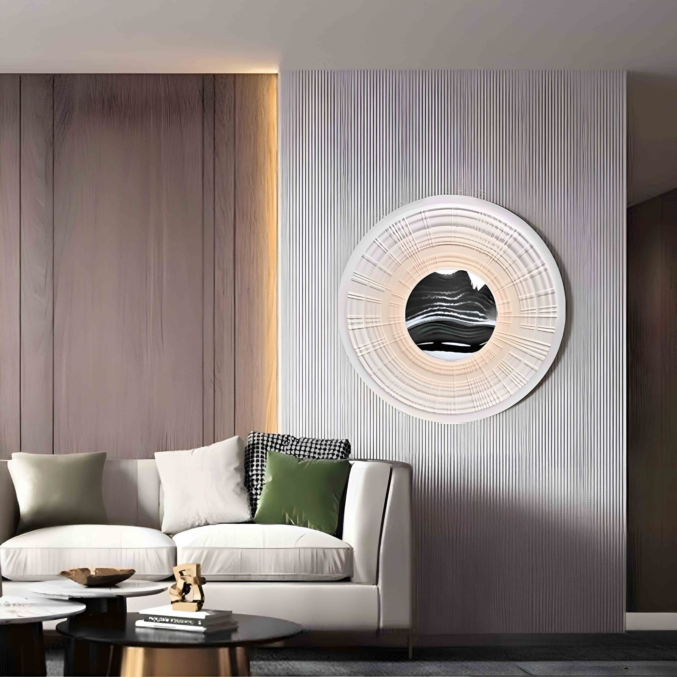 A modern living room showcases a white sofa with green and plaid pillows. The Ventus Onyx Strata Wood Carving 3D LED Wall Art by Giant Sculptures graces a textured gray wall, adding depth. Wooden elements and a small decorated table in the foreground enhance the cozy atmosphere.