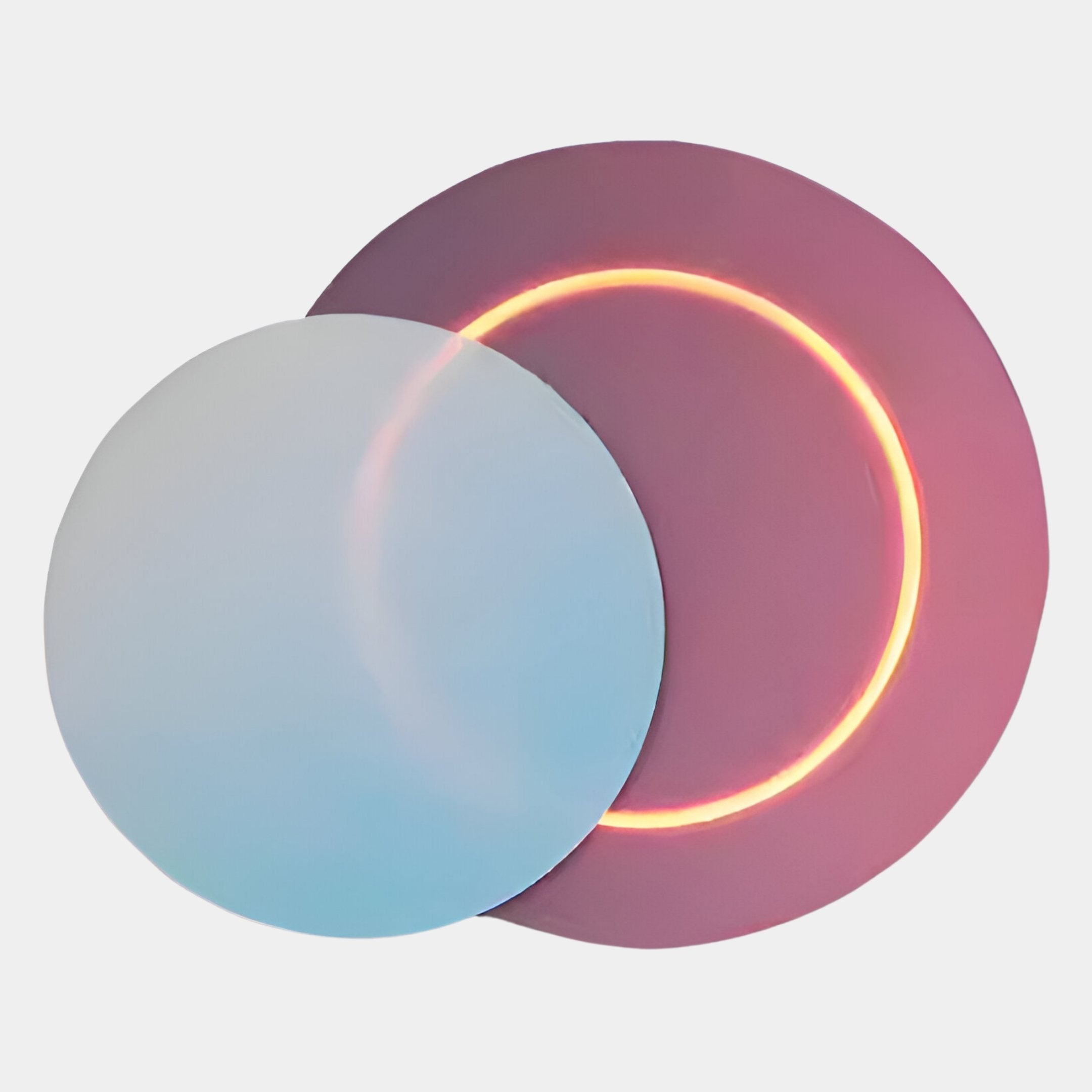 Two overlapping discs on white: the left is light blue, the right pink with a glowing orange ring—evoking Lunar Blush Sky Crystal Porcelain 3D Yellow LED Wall Art by Giant Sculptures.