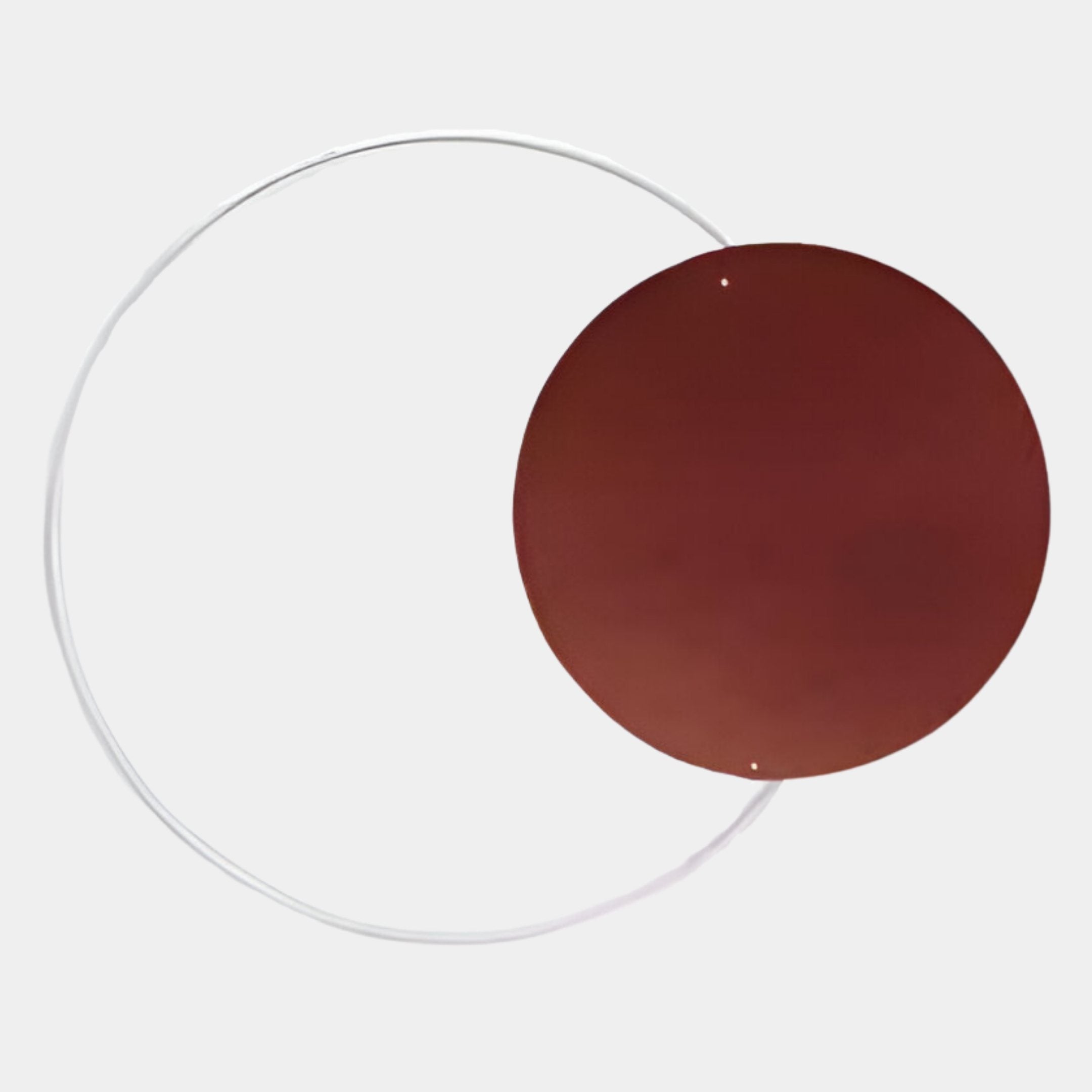 A thin, white metal ring partially overlaps with a large, flat copper-toned acrylic disc from the Soluna Copper Acrylic 3D LED Wall Art by Giant Sculptures, set against a plain light background.