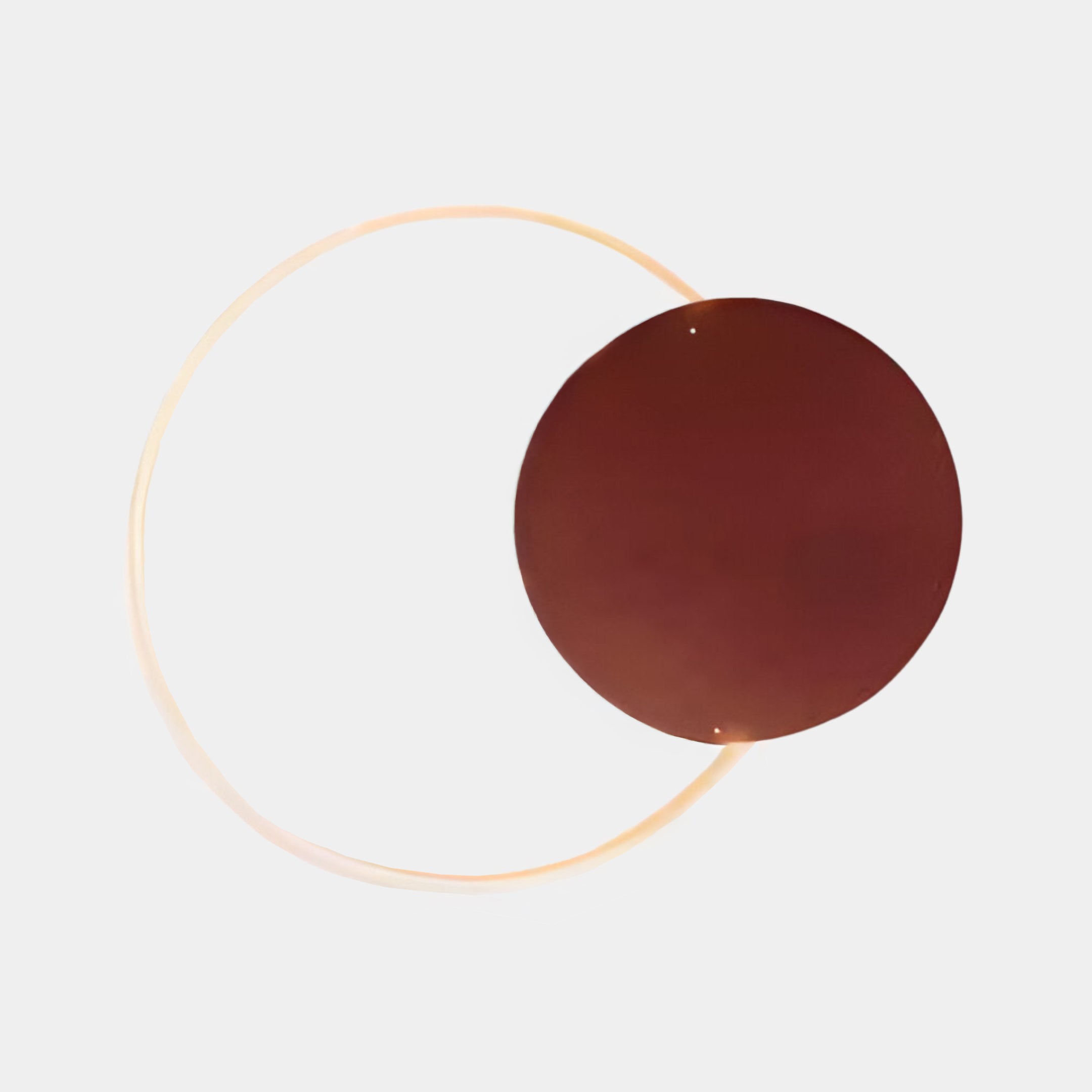 The Soluna Copper Acrylic 3D LED Wall Art by Giant Sculptures features a copper-toned acrylic disc overlapping a glowing ring, similar to an integrated LED tube, on a white background. The ring forms an incomplete halo around the brown circle.