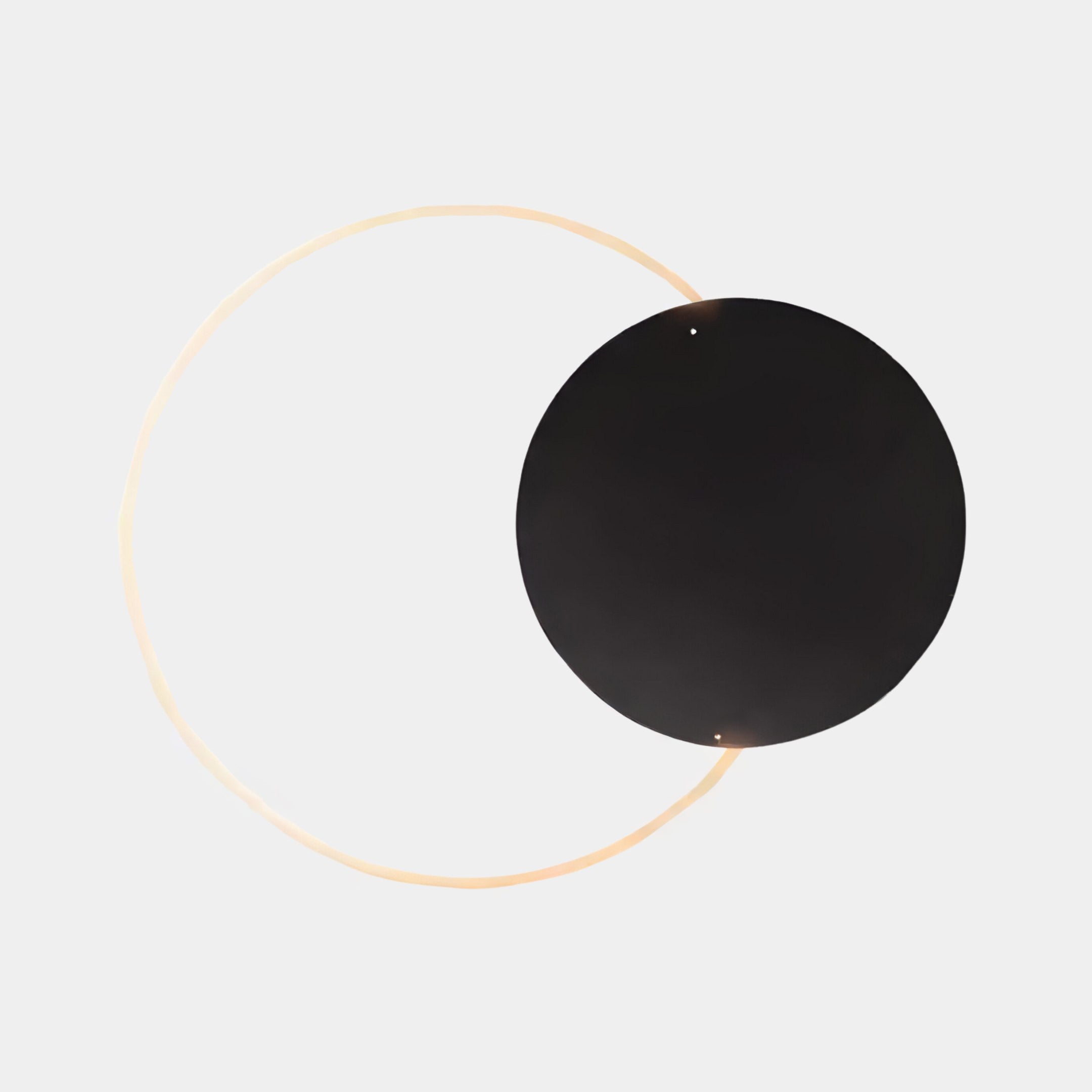 The Soluna Onyx Acrylic 3D LED Wall Art by Giant Sculptures features a black circle partially overlapping a glowing light on white, creating an eclipse-like artistic effect perfect for minimalist decor.