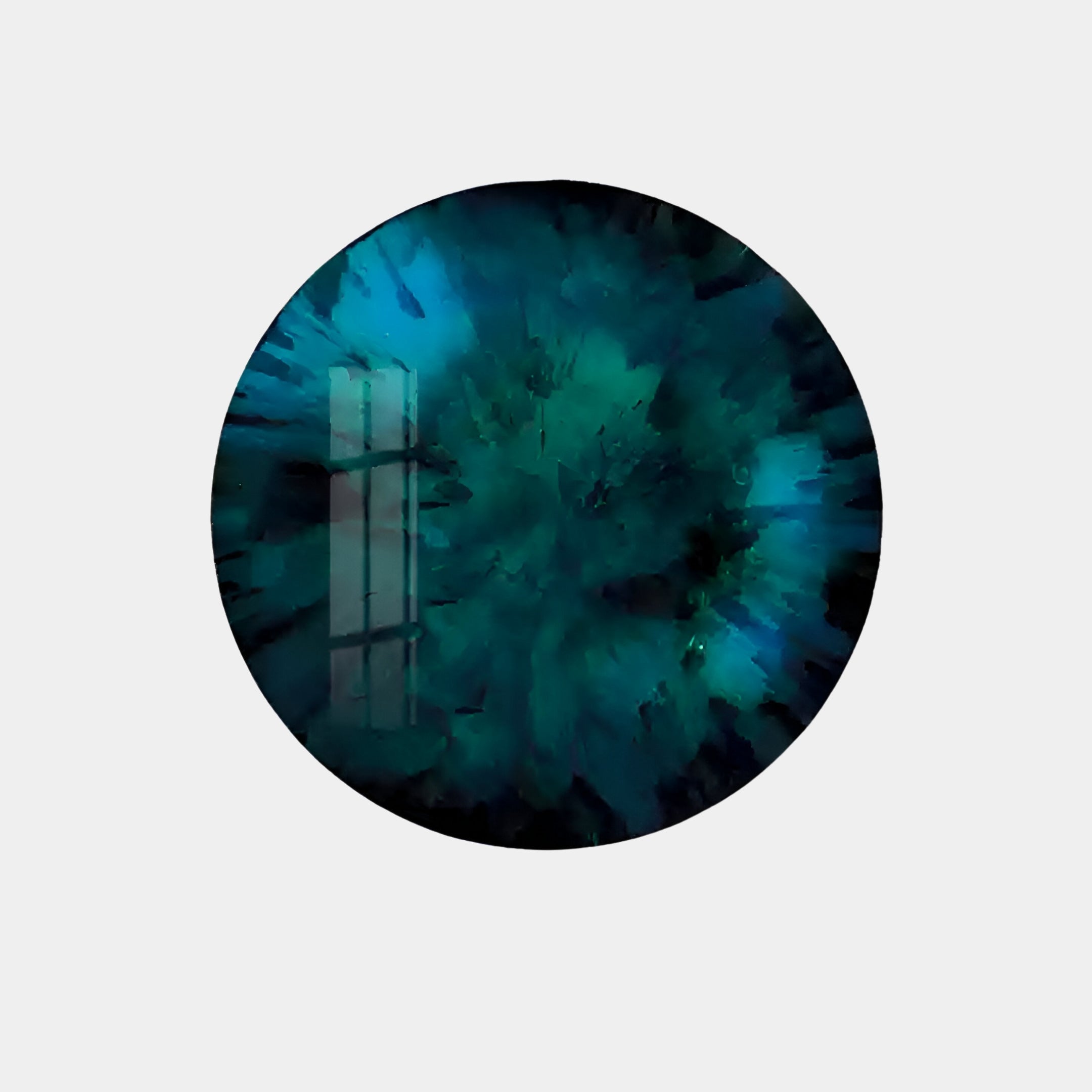 The Lumea Textured Turquoise 3D LED Crystal Porcelain Wall Art by Giant Sculptures features a circular, galaxy-inspired design in blue and green hues with abstract swirls and reflective qualities, highlighted by a window-like outline at its center.