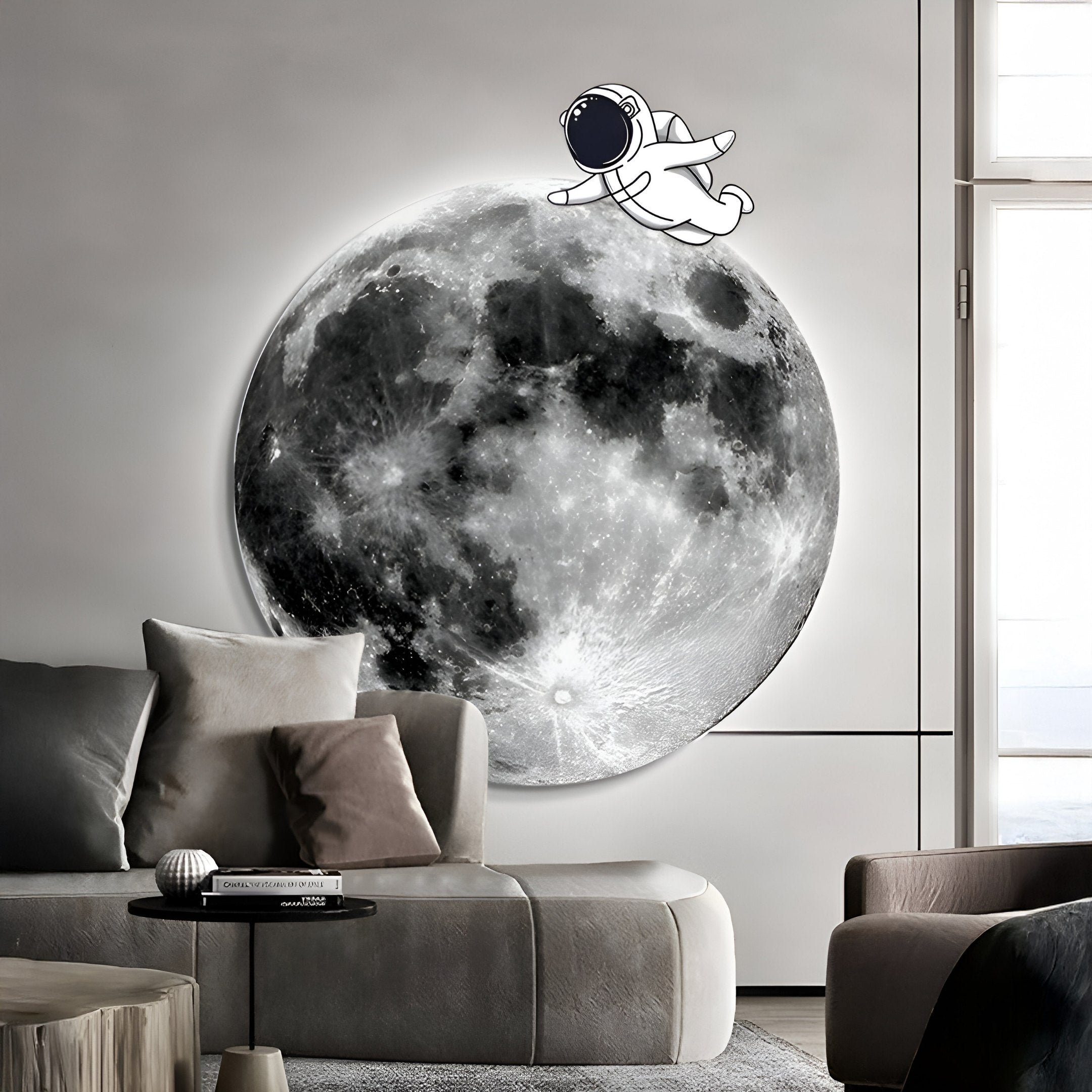 A living room displays a captivating moon mural featuring Giant Sculptures Cosmos Astronaut Drift UV Wood Carving LED Wall Art. Natural light highlights the chic space with a light gray sofa, cushions, and round coffee table, creating an airy vibe.