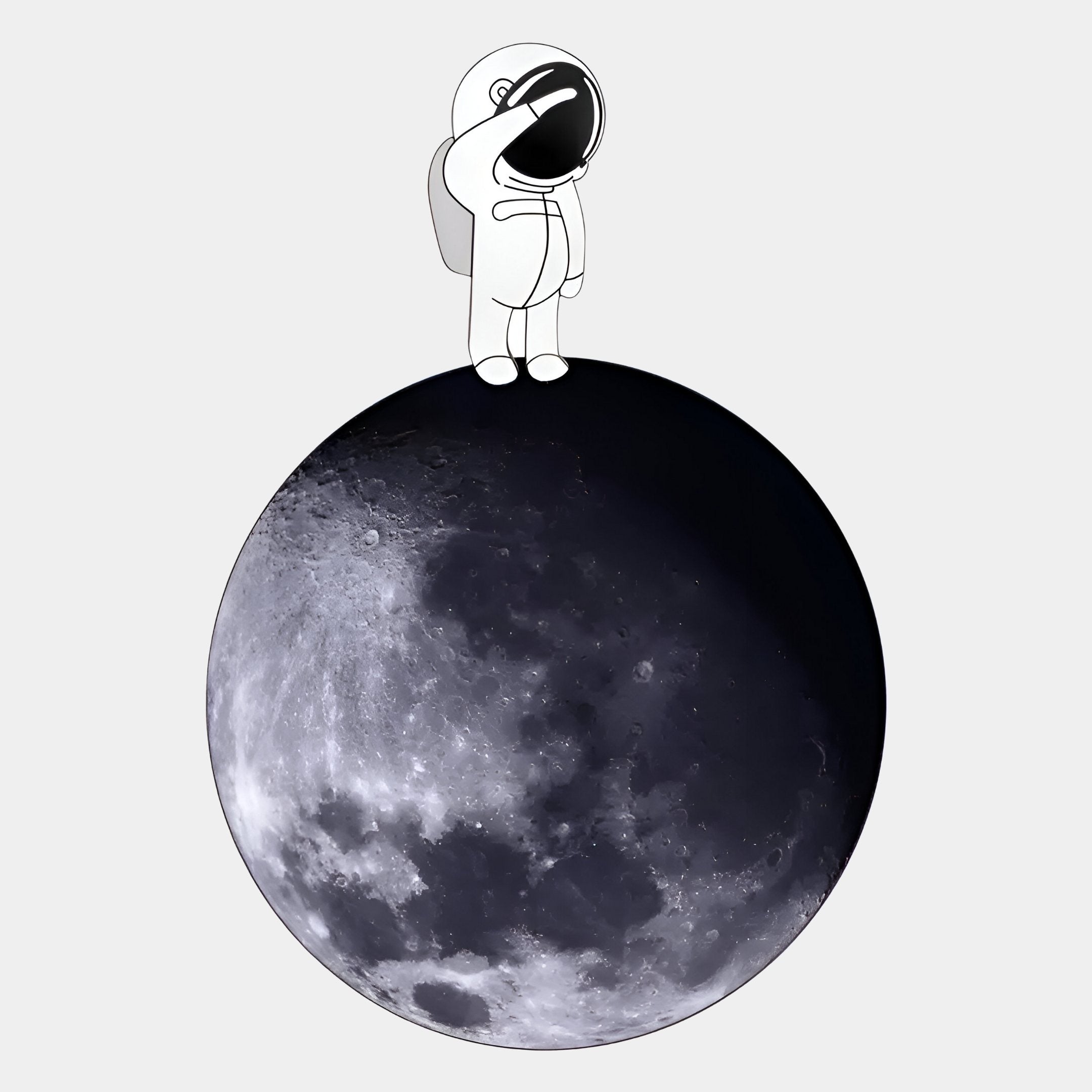 The Cosmos Astronaut Reflection UV Wood Carving LED Wall Art by Giant Sculptures features a simple astronaut atop a realistic moon, with their reflection visible on a plain light gray background.