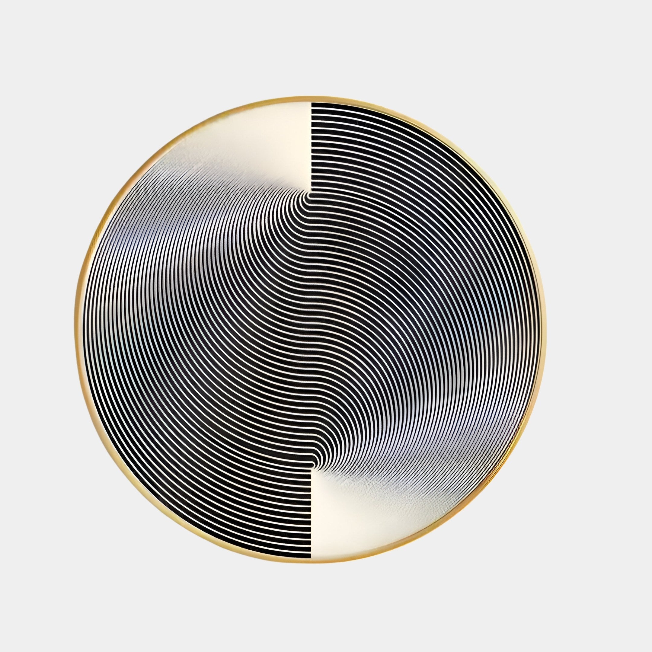 The Astral Silver Crystal Porcelain LED Wall Art by Giant Sculptures features black and white concentric circles forming an optical illusion. The left half has dense vertical lines, while the right transitions into a swirl, all framed in Astral Silver Crystal Porcelain with a gold border.