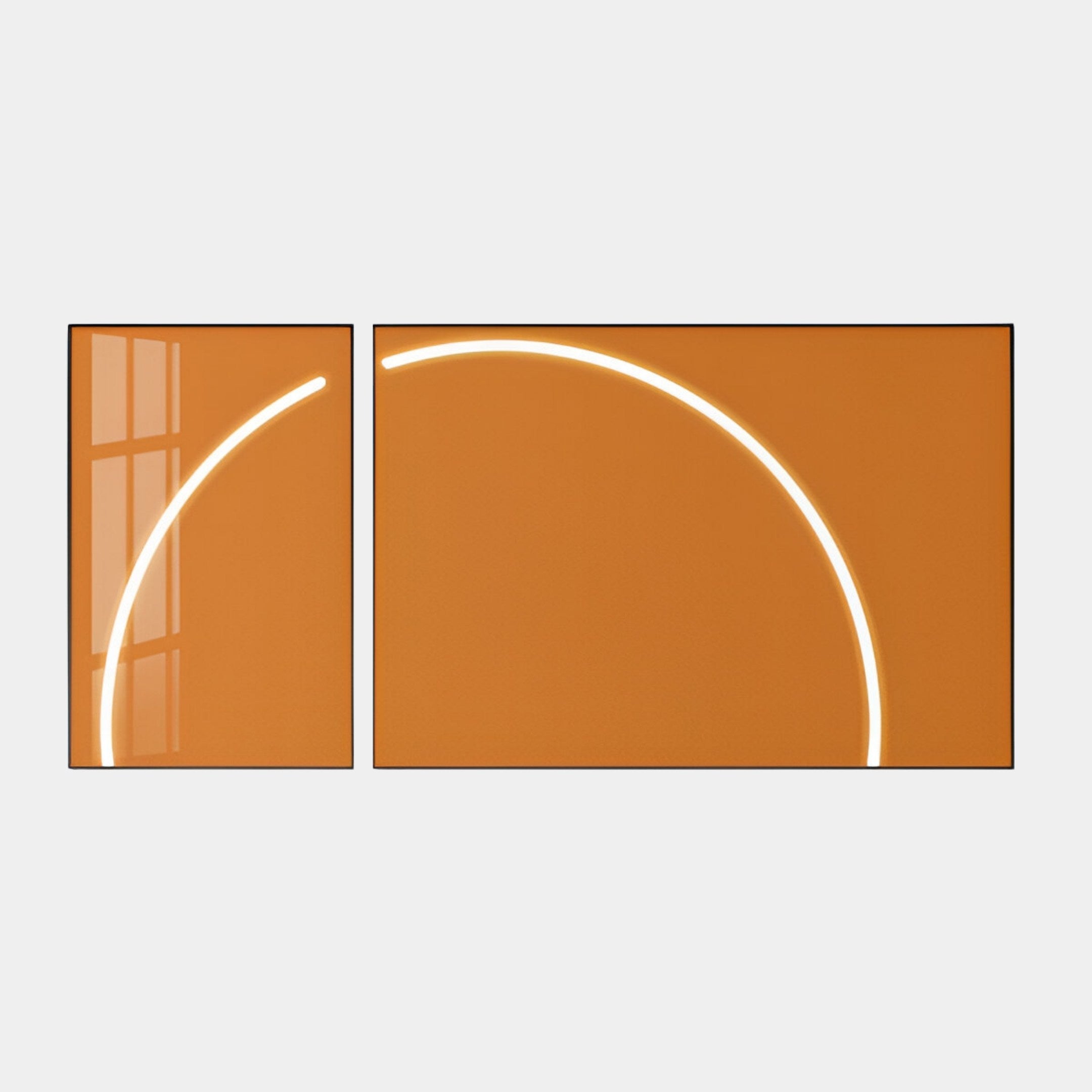 The Enigma Amber Sunrise LED Wall Art by Giant Sculptures features two art pieces with large orange backgrounds and white, curved lines. These contemporary designs form part of a circle when placed side by side, subtly reflecting a window on the left frame.