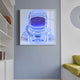 The Stellar Electric Sapphire Acrylic 3D LED Wall Art by Giant Sculptures showcases a glowing blue-outlined astronaut against a gray wall. Books on shelves to the left and a yellow-cushioned sofa or bed on the right complete this vibrant scene.