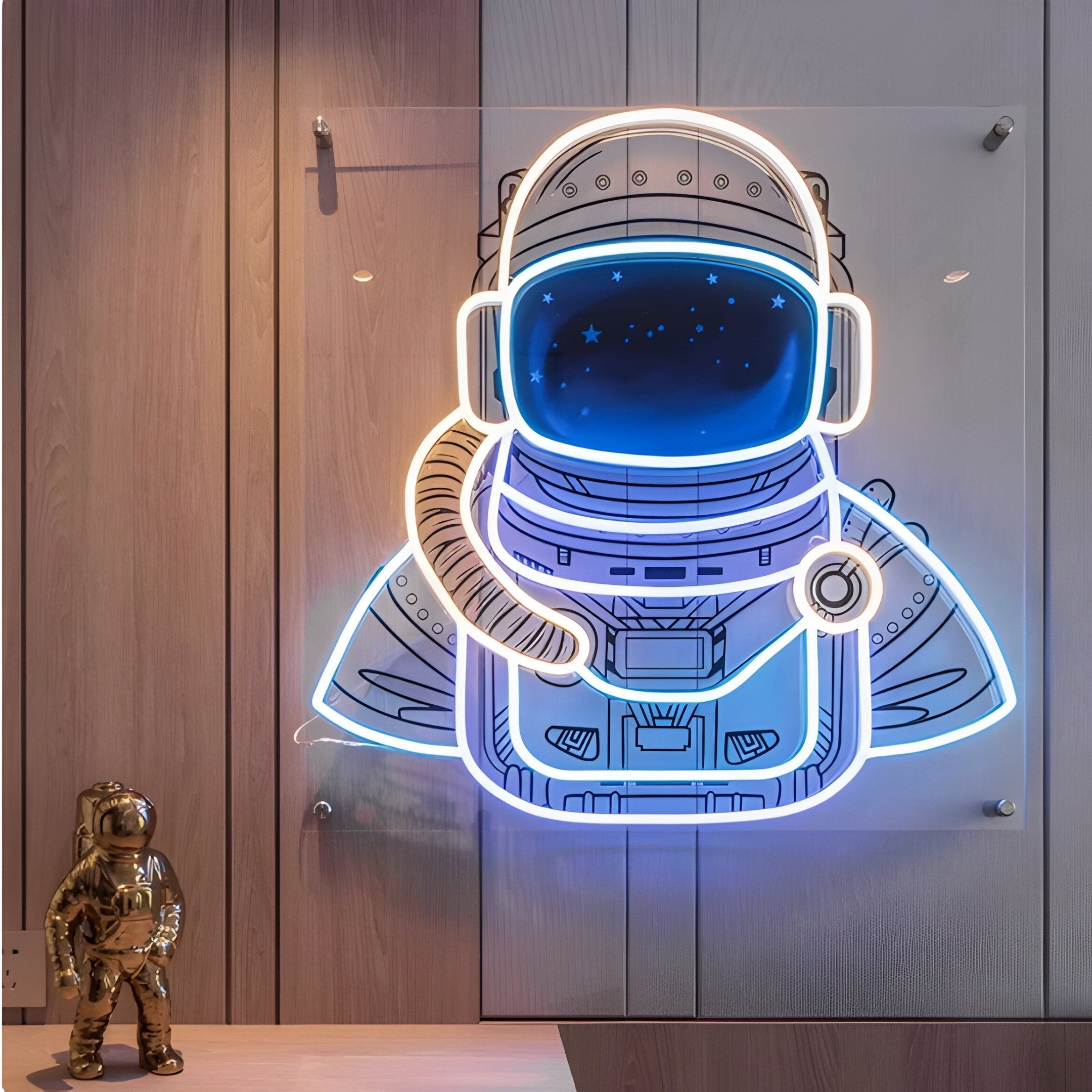 Giant Sculptures Stellar Celestial Blue Acrylic 3D LED Wall Art features an astronaut with a blue helmet visor on a wooden panel, accompanied by a small metallic astronaut figurine, perfect for enhancing modern interiors.