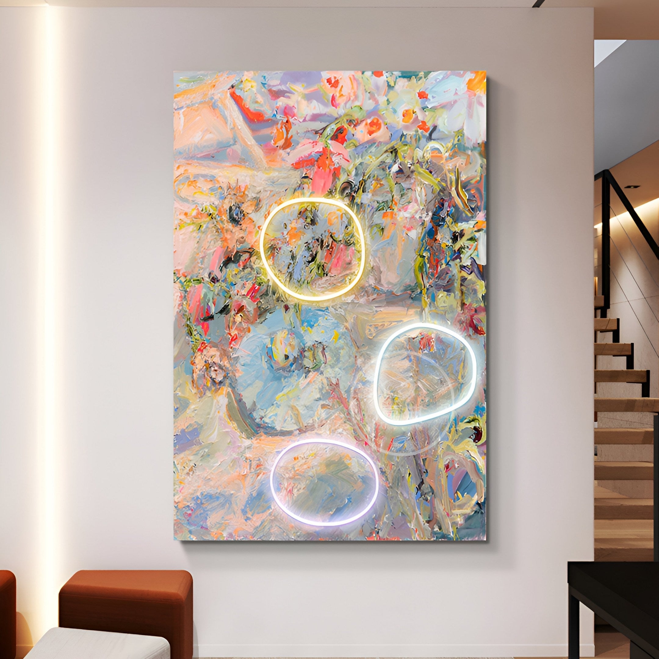 The rooms modern decor includes an Elysian Pastel Bloom Oil Painting 3D LED Wall Art by Giant Sculptures, featuring swirling pastel colors and three glowing neon rings on a white wall with brown seating and a staircase in the background.