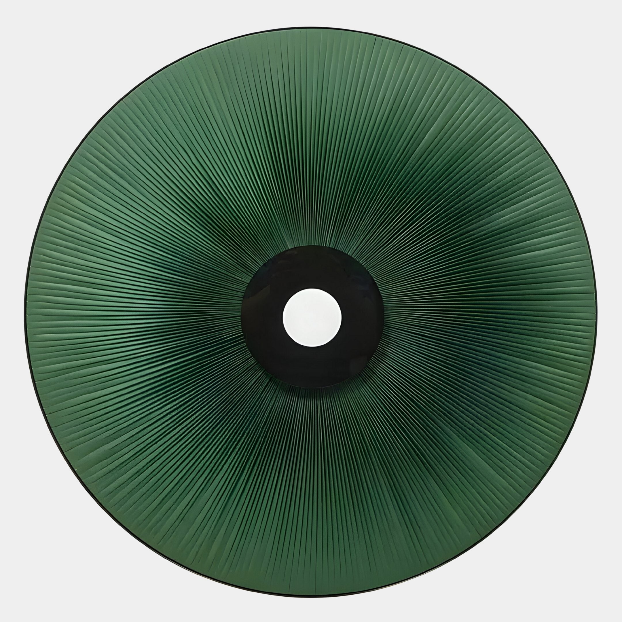 The Vanguard Jade Surge Leather 3D LED Wall Art by Giant Sculptures is a circular green piece with radiating lines from a central black and white disc, creating an abstract sunburst or eye design—ideal for modern spaces, shown from above on a white background.