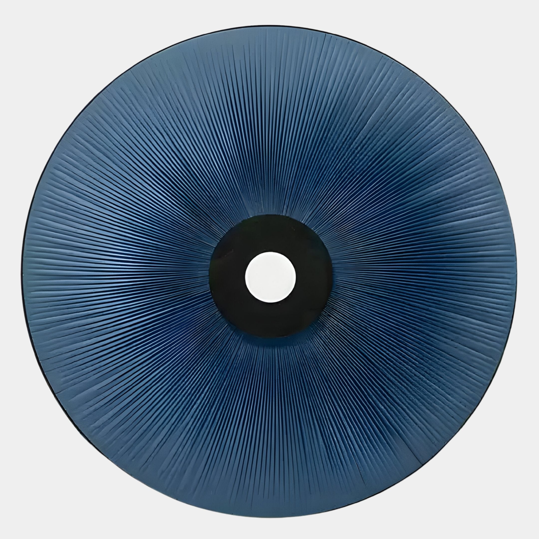 The Vanguard Midnight Indigo Leather 3D LED Wall Art by Giant Sculptures features a circular design with a central hole and radiating lines, adding a striking sunburst glow—ideal for contemporary spaces.