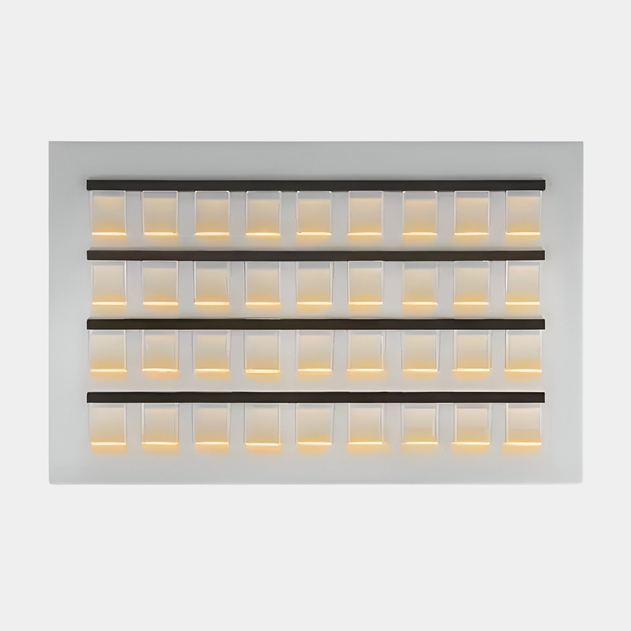 The Zenith White 3D Horizontal Acrylic LED Layered Wall Art by Giant Sculptures enhances contemporary interiors with its grid of translucent, rectangular panels. Illuminated from the bottom, it casts a warm glow in rows and columns against a white background as stunning LED wall art.