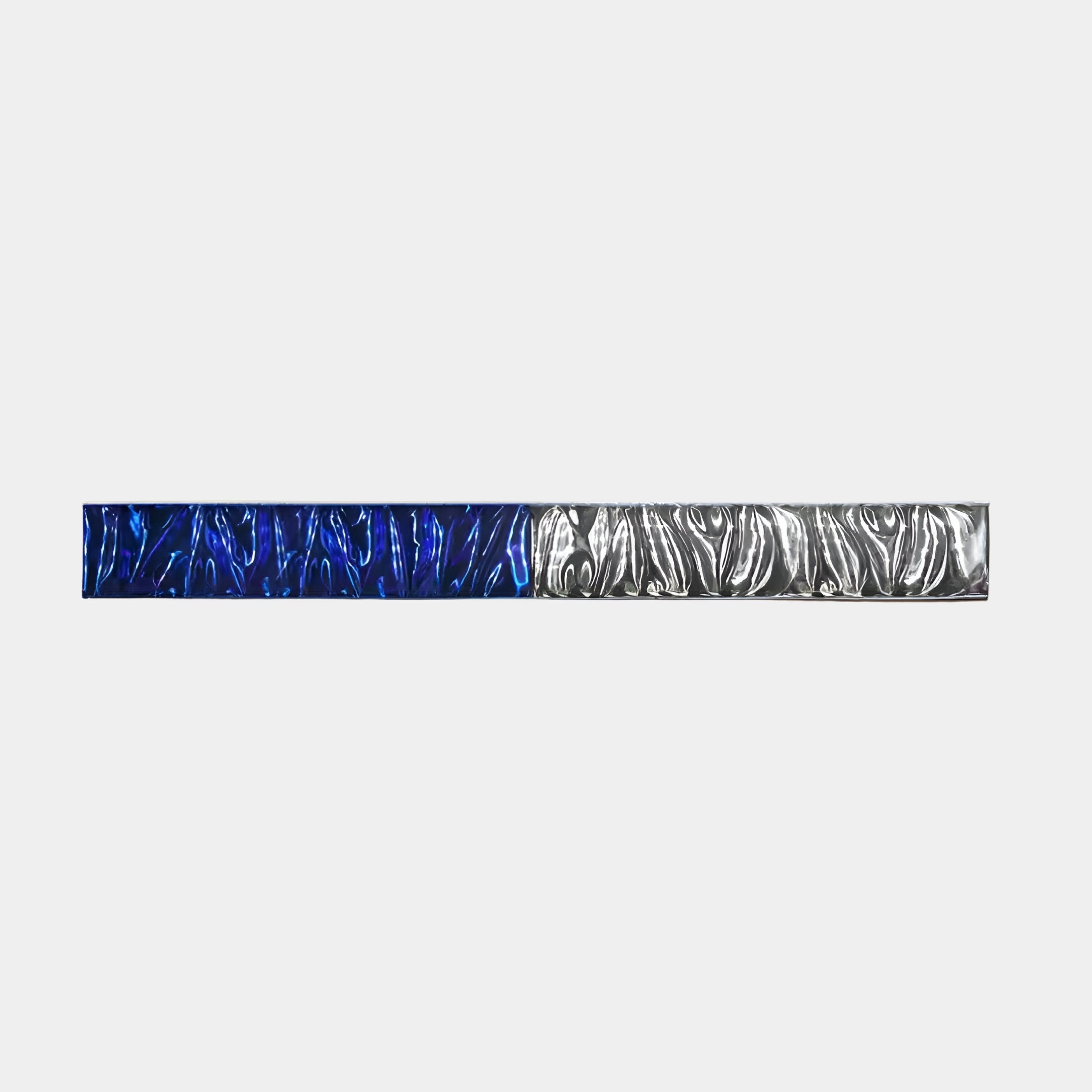 Giant Sculptures Textura 3D Blue and Silver Leather Design Wall Art features a long, rectangular strip with deep blue and metallic gray textured patterns on each half, set against a white background, creating modern elegance with contrasting colors.