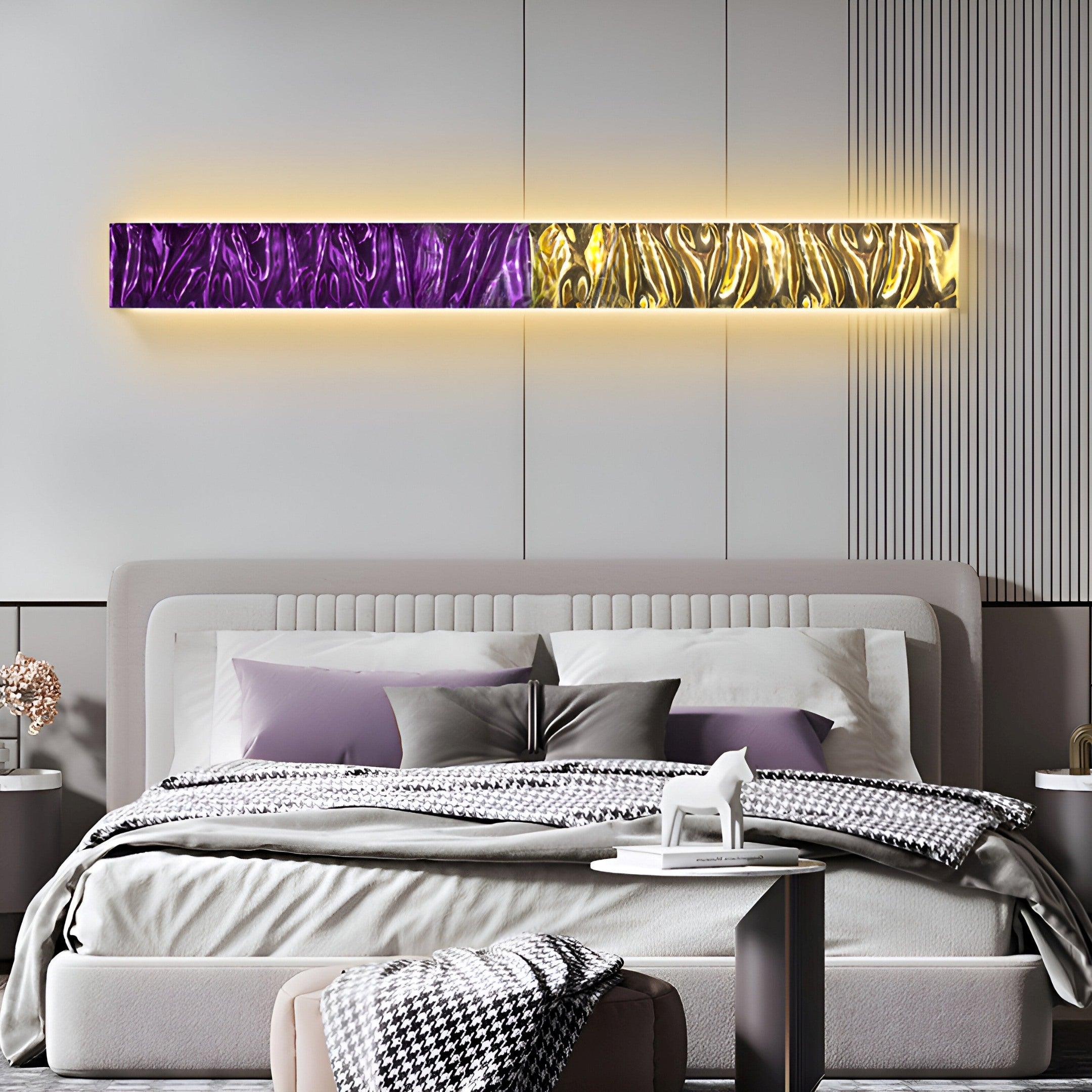 A modern bedroom features a stylish bed with gray pillows and a houndstooth blanket. Above, the Textura 3D Purple and Gold Leather Design Wall Art by Giant Sculptures adds elegance with its illuminated abstract textures, enhancing the minimalist decor.