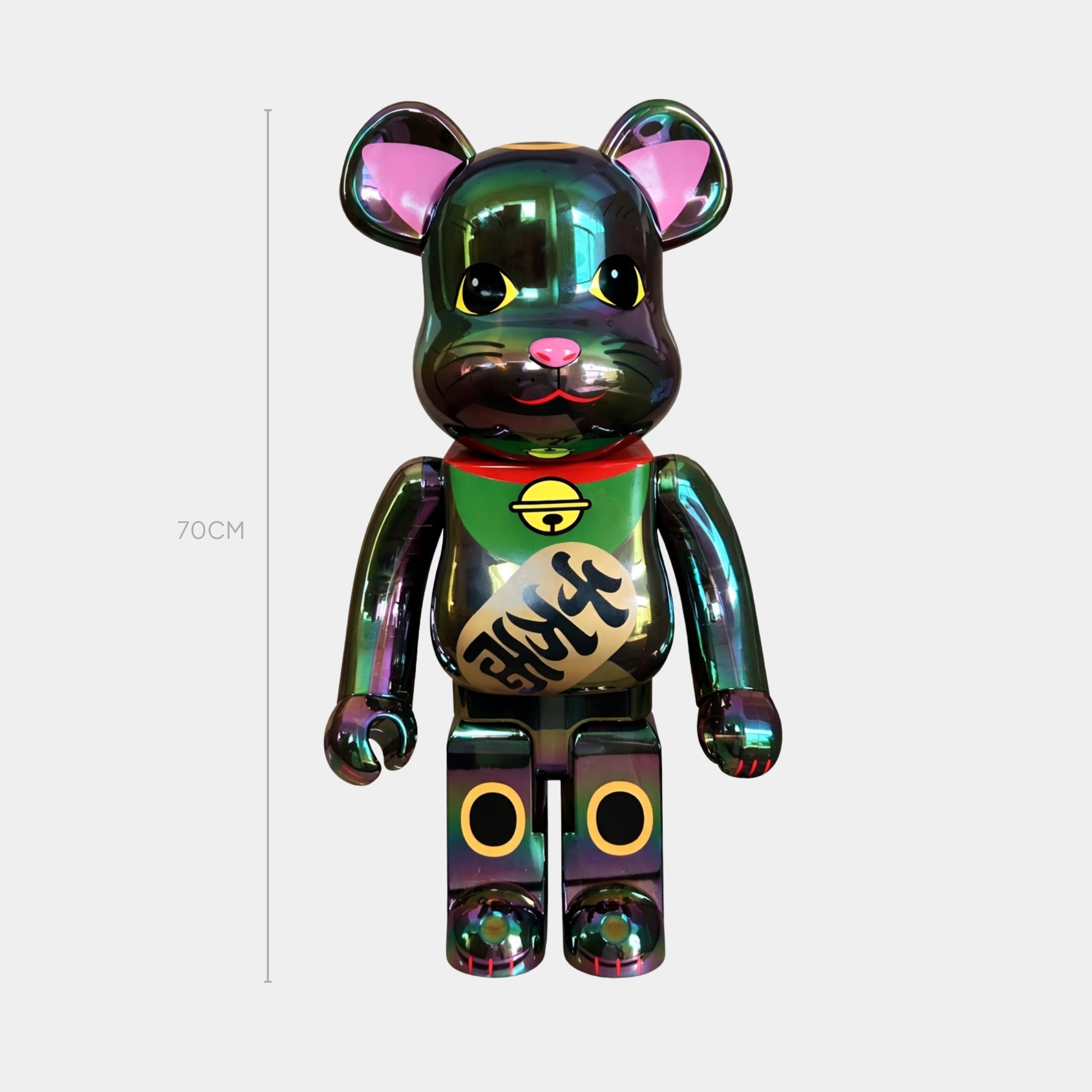 The Giant Sculptures Lucky Paw Green Bear Sculpture, 70cm tall and multicolored with pink ears, yellow eyes, and Japanese writing on its chest, stands upright against a plain light gray background.