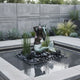 Life-Size Classical Seated Mermaid Bronze Fountain by Giant Sculptures, two-tone patina figure on black pebbles in a square pond within a modern concrete garden.