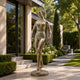 Life-Size Classical Standing Nude Female Bronze Sculpture by Giant Sculptures in verdigris patina, displayed on a modern garden path beside a stone entrance.