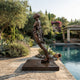 Life-Size Contemporary Diver Bronze Sculpture by Giant Sculptures, 310cm nude male figure leaning forward on a bronze platform beside a poolside garden.