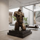 Life-Size Modern Female Torso Bronze Sculpture by Giant Sculptures, 140cm headless figure with warm brown patina, displayed on a black stepped plinth in a gallery.