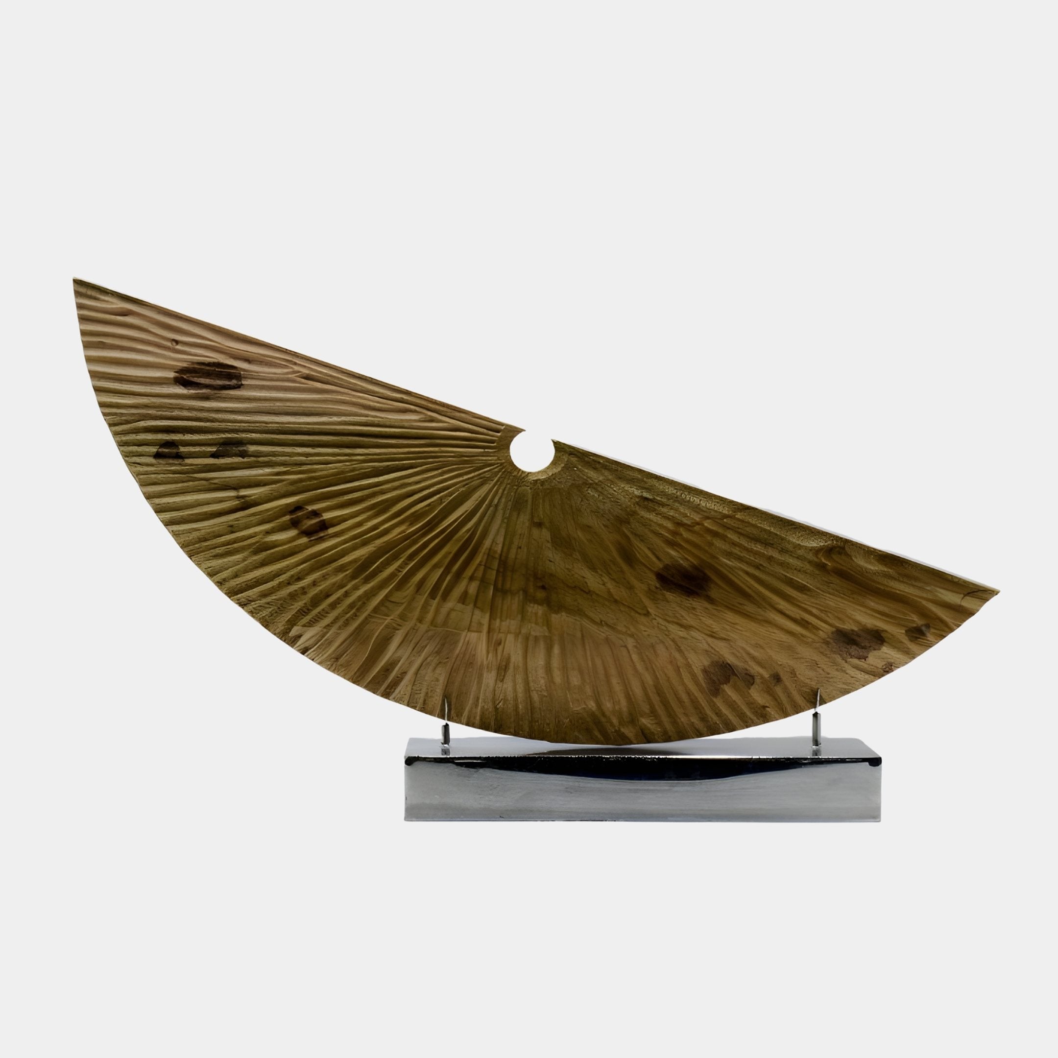 Crescent Soleil Abstract Wood Sculpture in honey-brown wood with radiating carved sunburst rays, mounted on a polished chrome plinth against a white background.