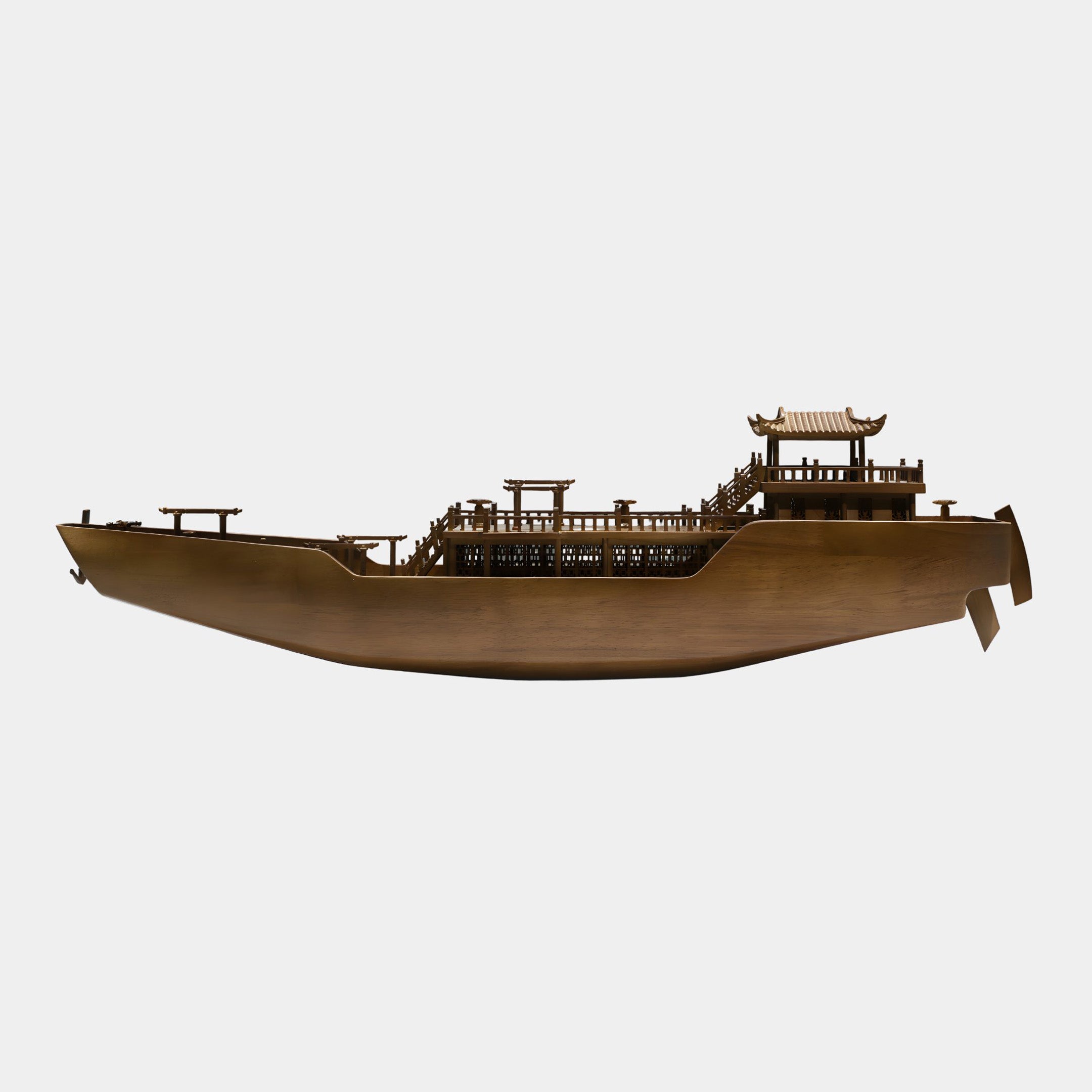 Giant Sculptures Boat Shaped Abstract Wood Sculpture 84cm in warm bronze-brown wood, side view showing lattice railings and stern pagoda pavilion on a plain background.