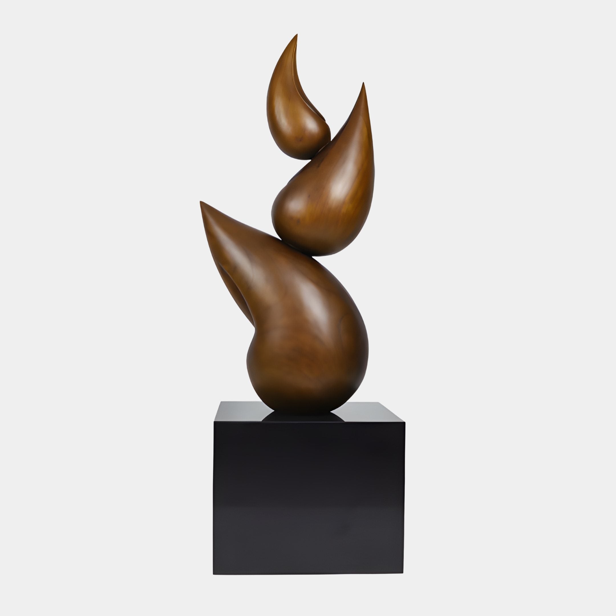 Twin Flame Bronze Abstract Wood Sculpture 150cm by Giant Sculptures, stacked teardrop forms in warm bronze on a black plinth against a plain light background.