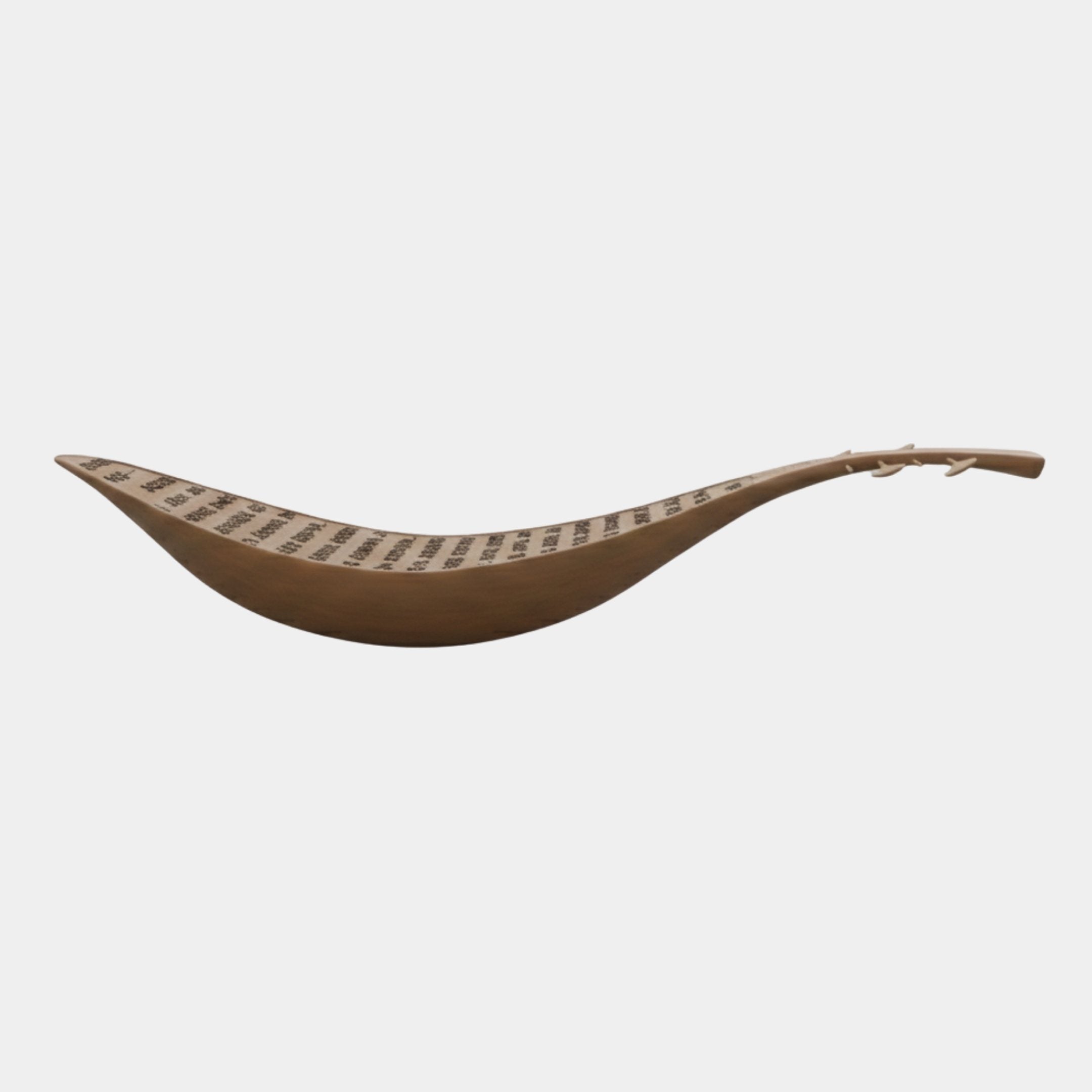 Scripture Vessel Natural Abstract Wood Sculpture by Giant Sculptures, a 250cm honey-toned boat-form carving with inscribed text and leaf finial, on white.