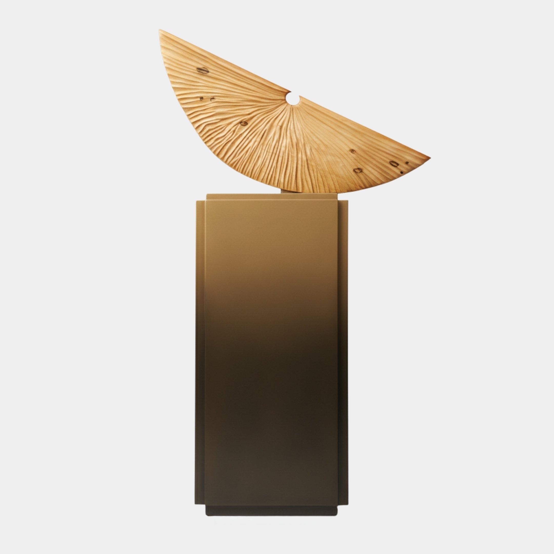 Crescent Natural Wood On Metal Plinth 163cm by Giant Sculptures, a hand-carved pale wood fan with radiating rays atop a tall brushed-bronze gradient plinth.