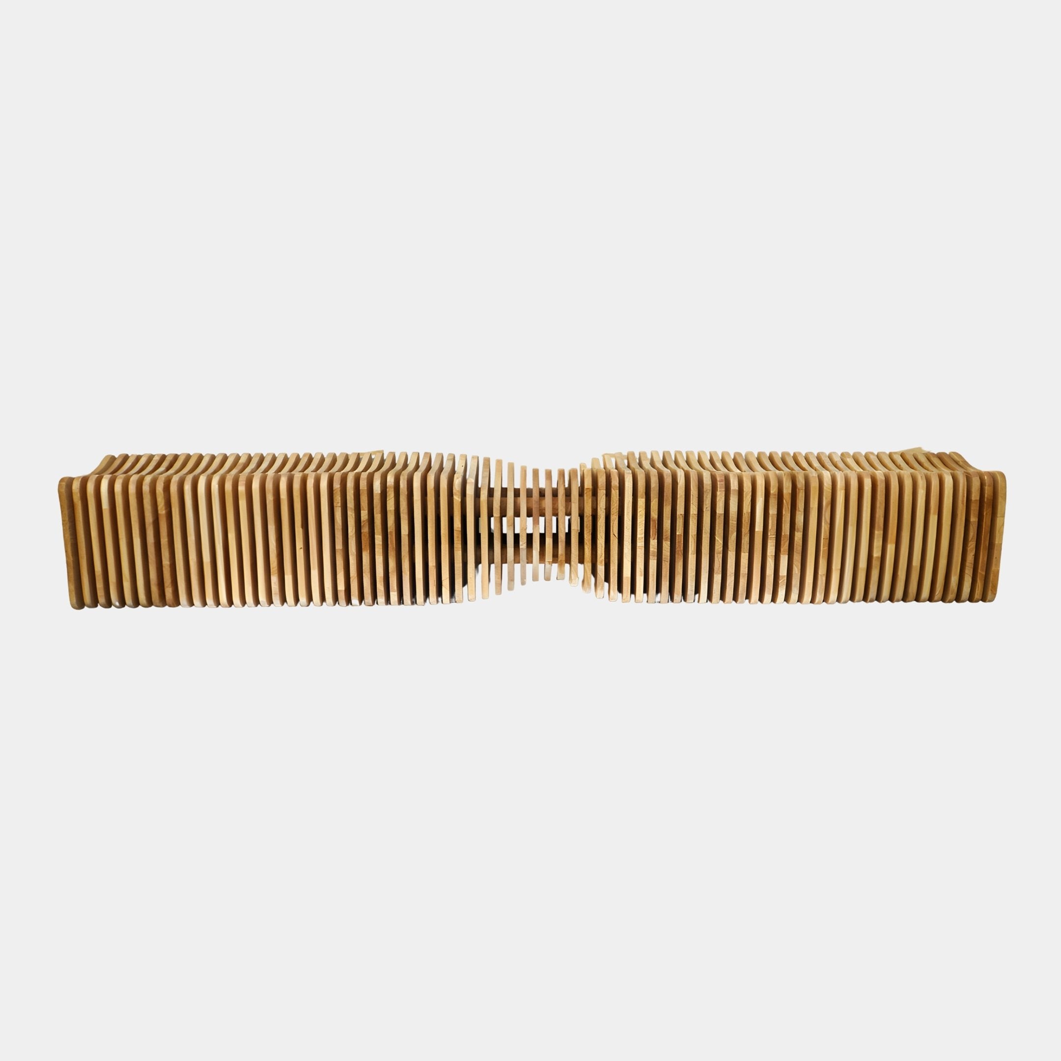 Hourglass Slatted Wood Bench Sculpture 280cm by Giant Sculptures, shown side-on with honey-toned vertical slats pinched at the centre, on a plain white background.