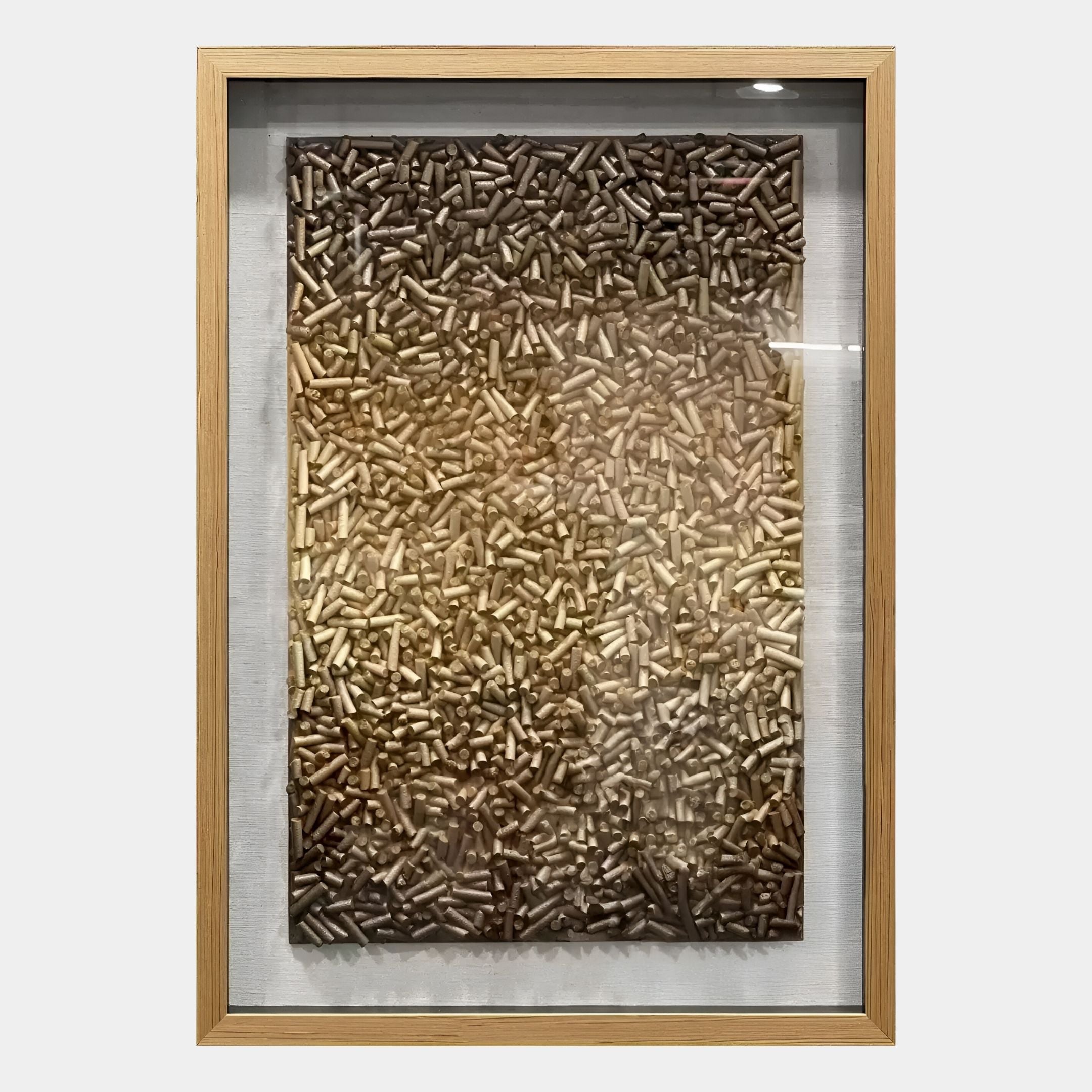 The Brivora Golden Bronze Gradient Textured 3D Wall Art by Giant Sculptures features a dense array of small, cylindrical brown and tan elements that form a stunning gradient pattern from light to dark, adding eye-catching texture to your walls.